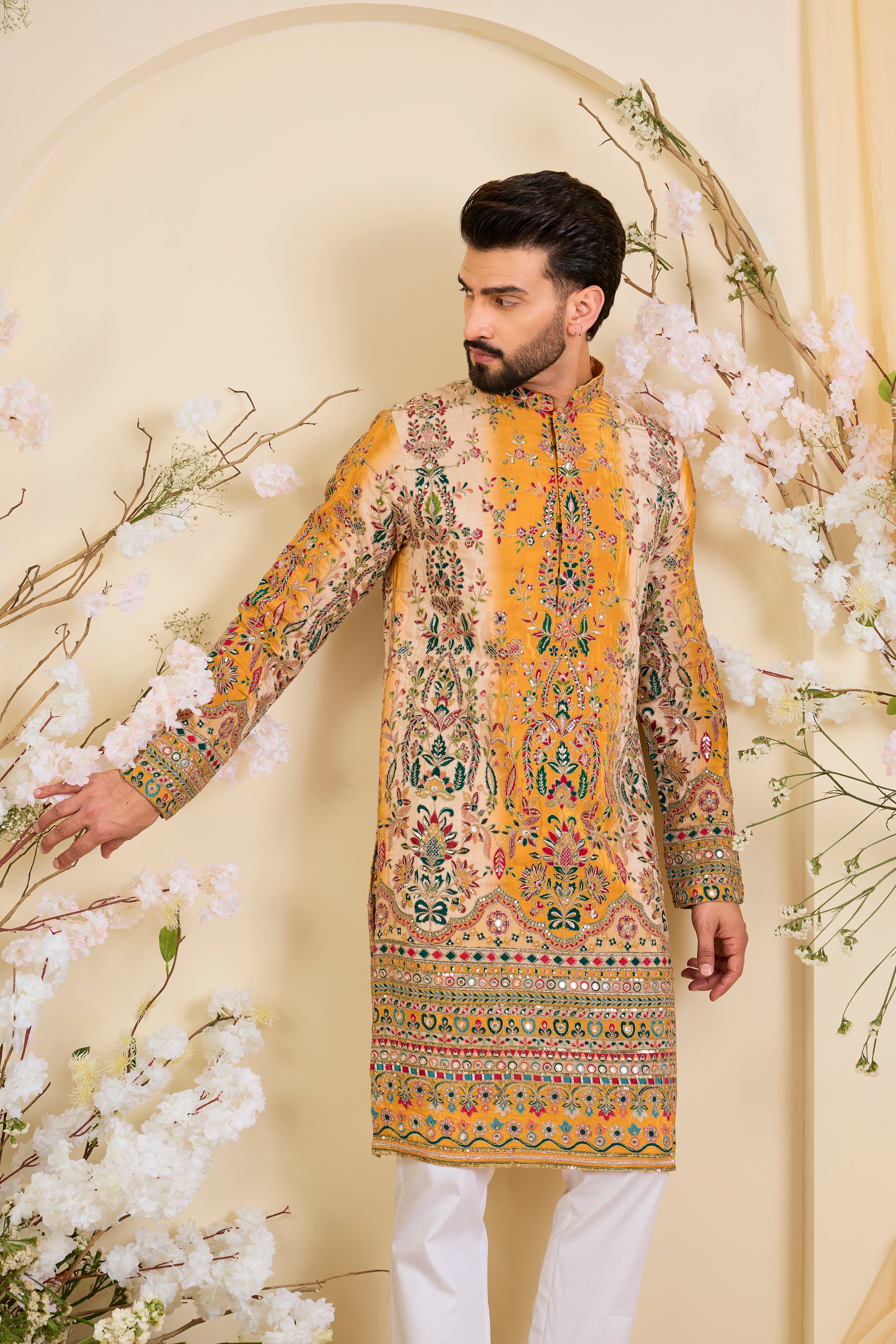 Green crepe  kurta with intricate zari work, vibrant multicolour prints, and refined sequin detailing.