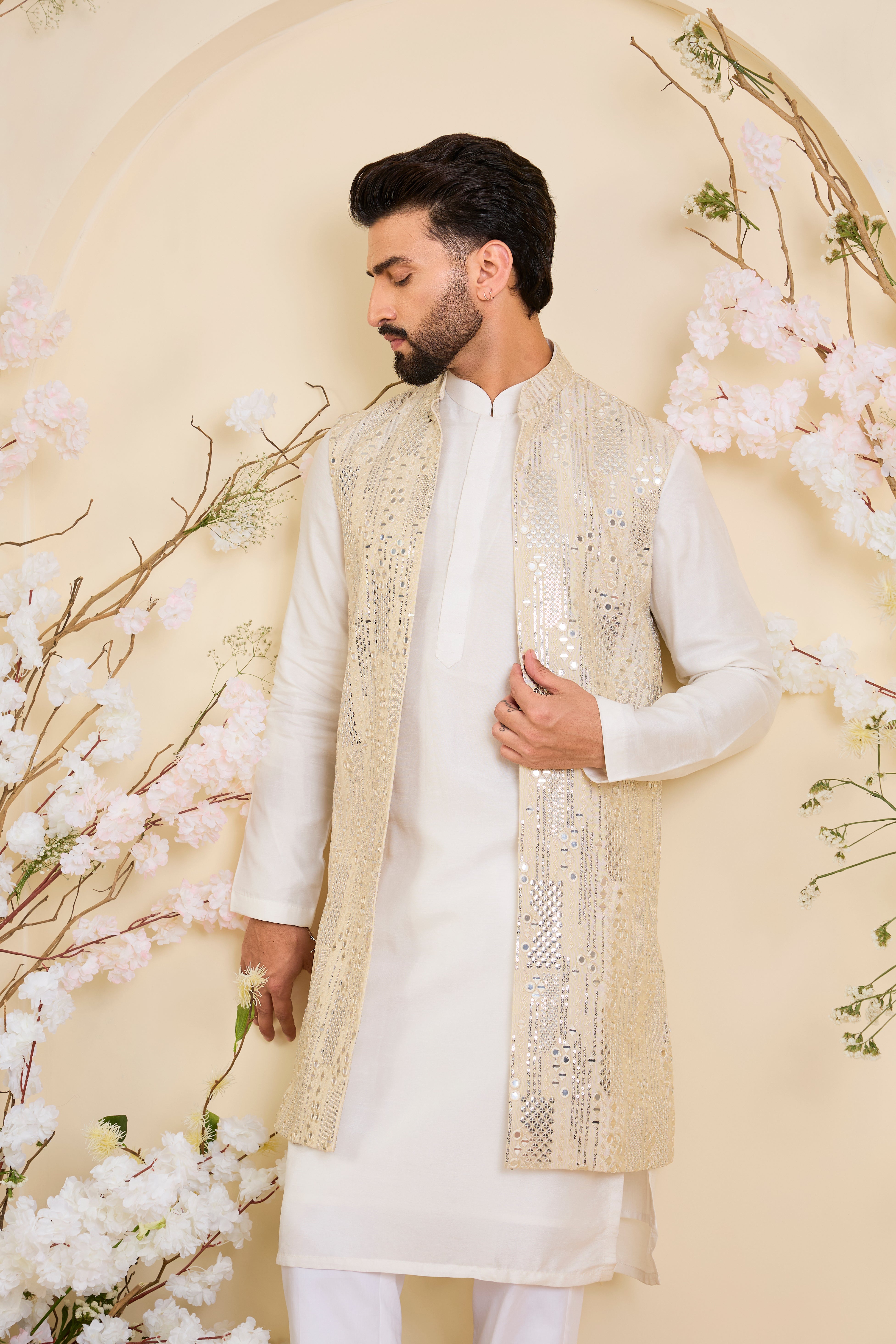 Crafted in luminous tissue, this long open jacket is intricately detailed with sequin mirrorwork, creating a refined illusion of traditional mirrors.