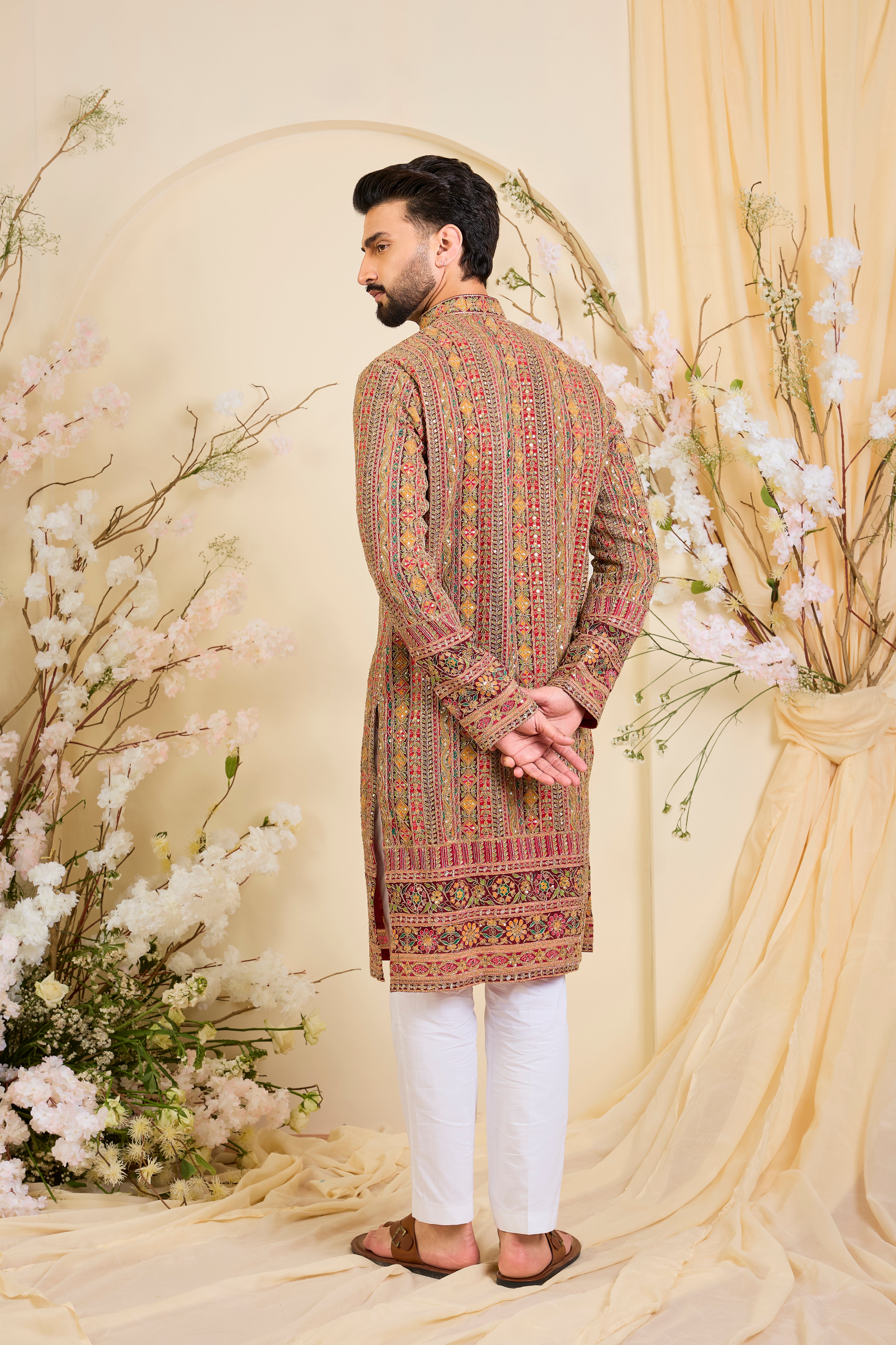 Pink base  kurta with heavy zari embroidery, intricate sequins, and multicolour prints, crafted for bold, opulent, statement-making occasions.