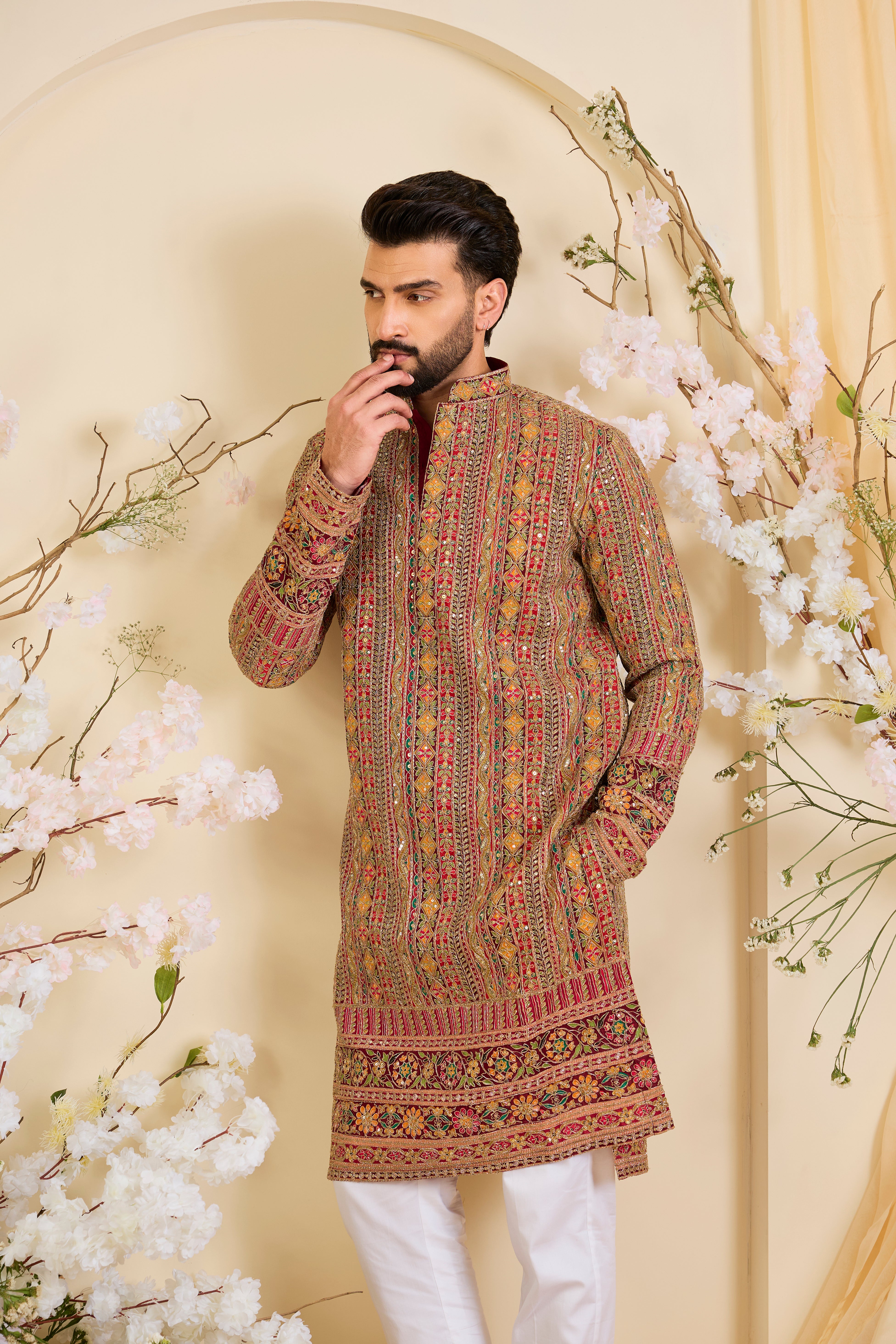 Pink base  kurta with heavy zari embroidery, intricate sequins, and multicolour prints, crafted for bold, opulent, statement-making occasions.