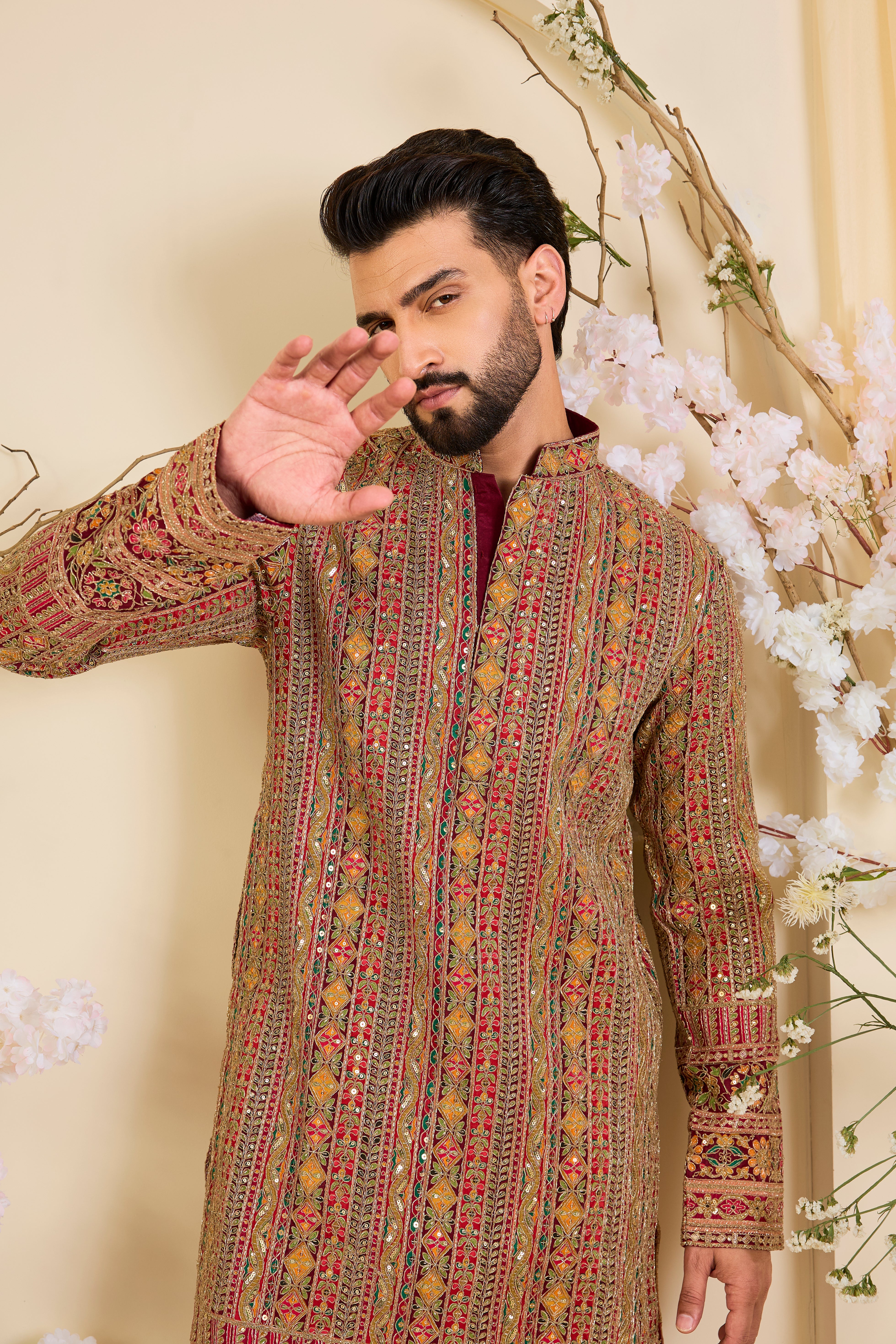 Pink base  kurta with heavy zari embroidery, intricate sequins, and multicolour prints, crafted for bold, opulent, statement-making occasions.