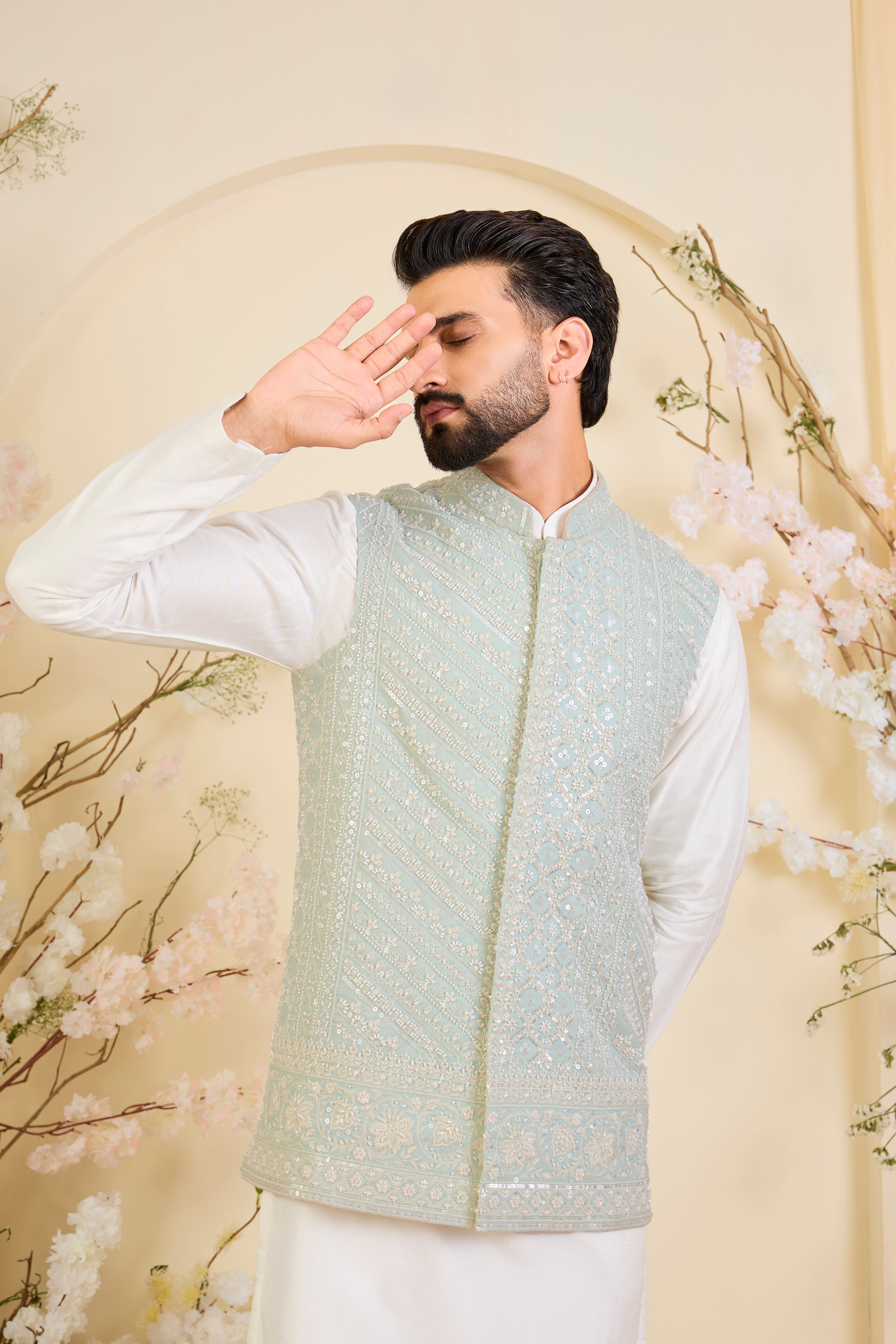 Powder blue Nehru jacket with hand embroidery and delicate ivory cut dana work, offering a soft, luminous, and refined couture expression.
