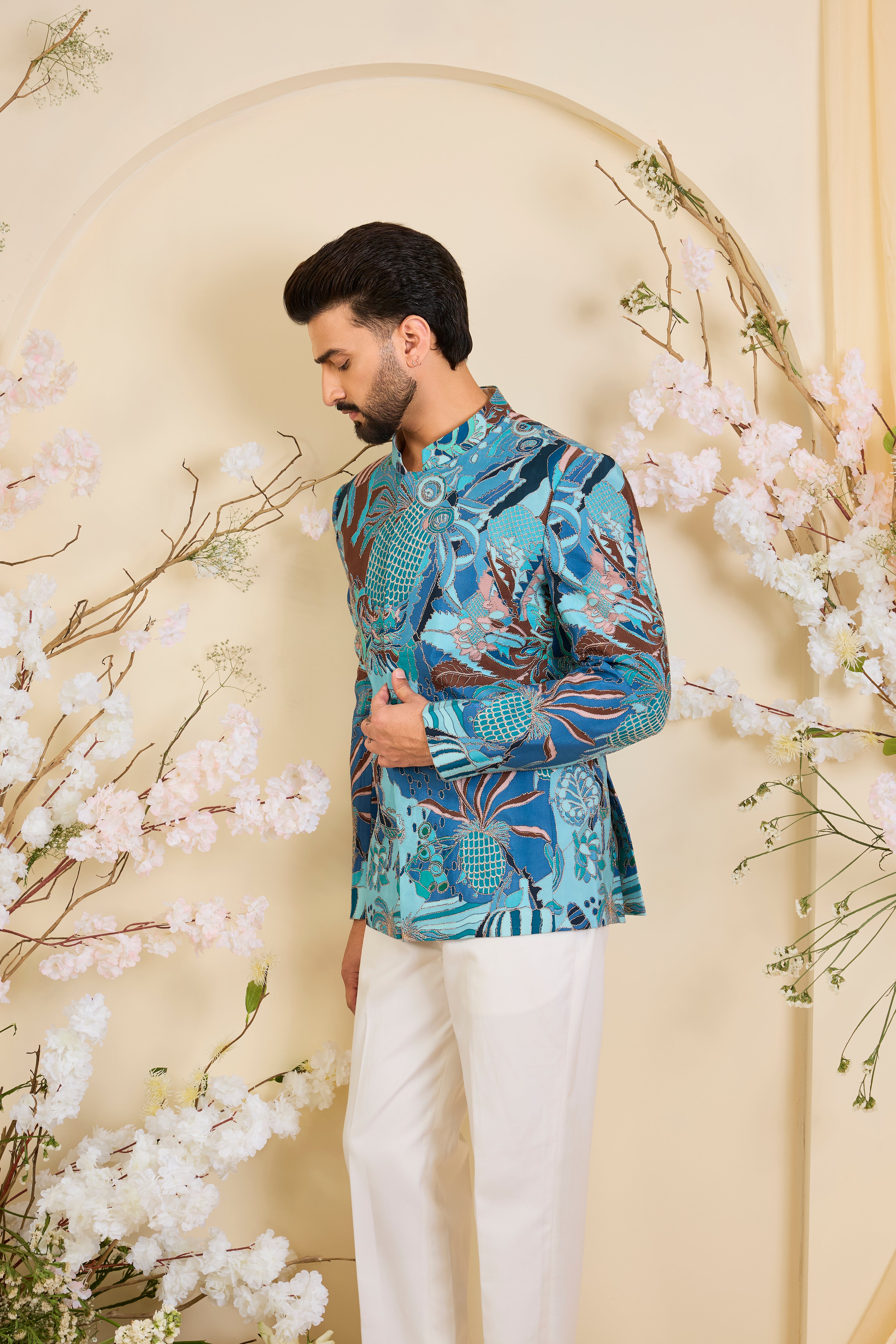 Blue abstract bandhgala with detailed multicolour prints and intricate zari accents, blending artistic expression with refined, modern elegance.