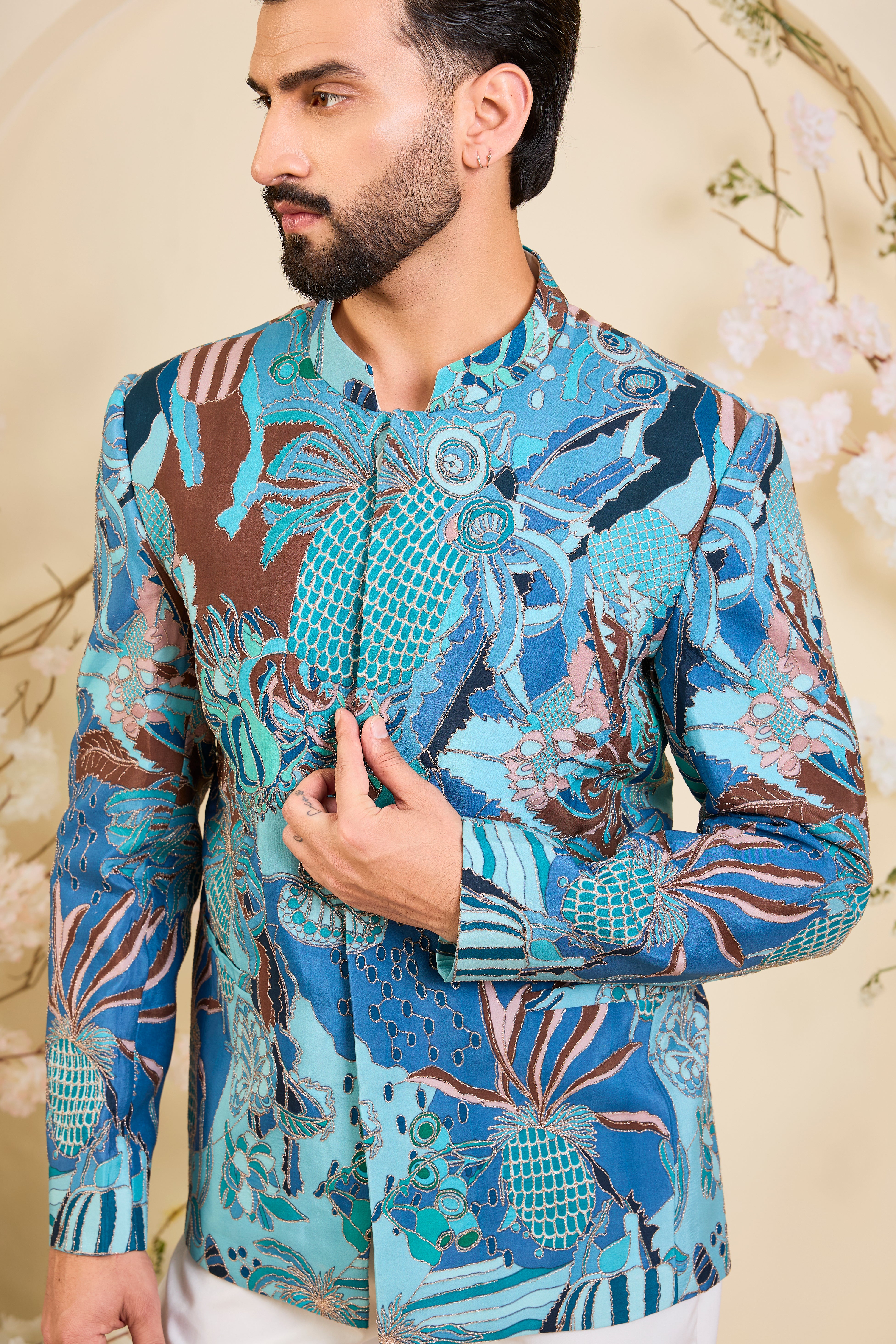 Blue abstract bandhgala with detailed multicolour prints and intricate zari accents, blending artistic expression with refined, modern elegance.