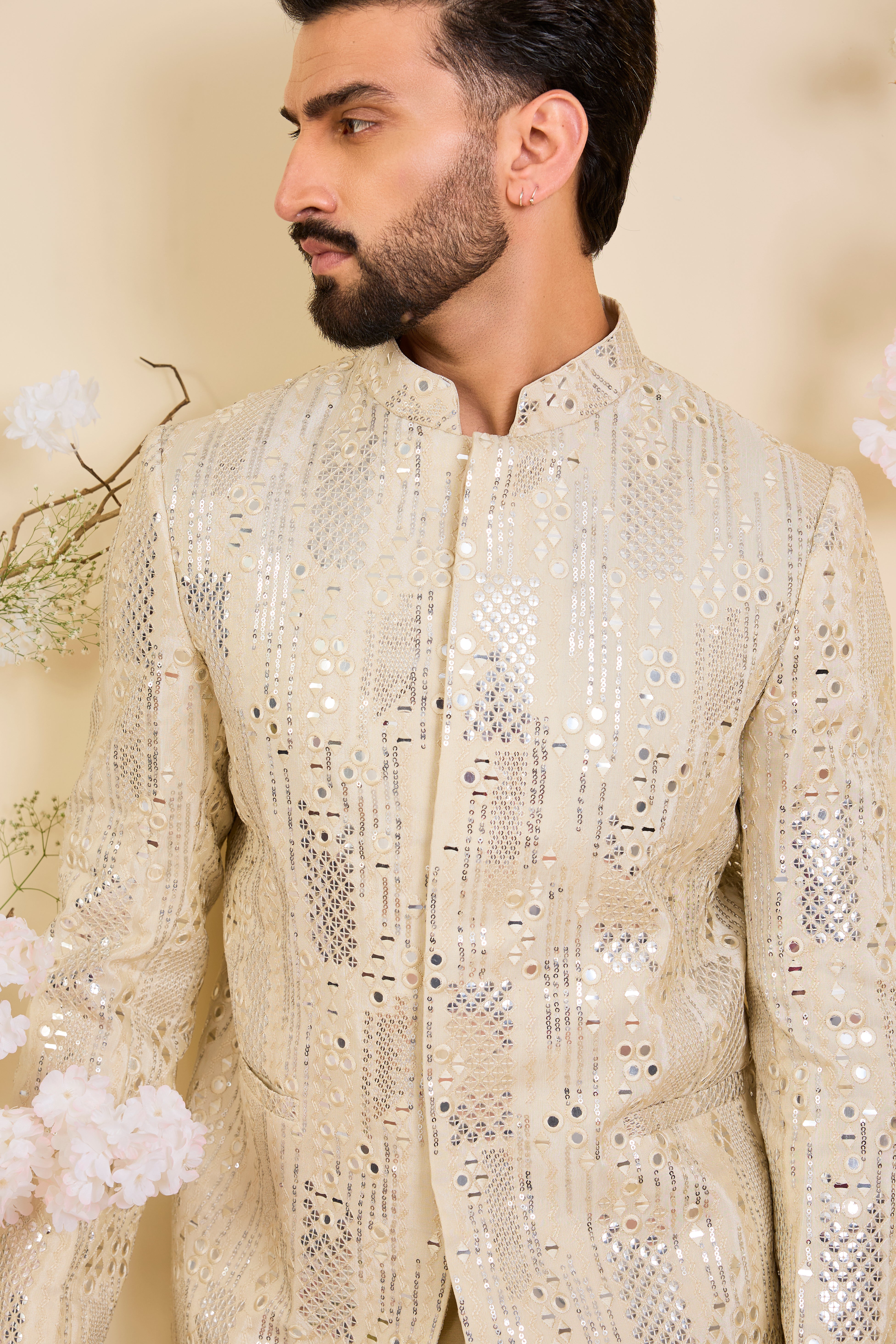 Crafted in luminous tissue, this bandgala is intricately detailed with sequin mirrorwork, creating a refined illusion of traditional mirrors.