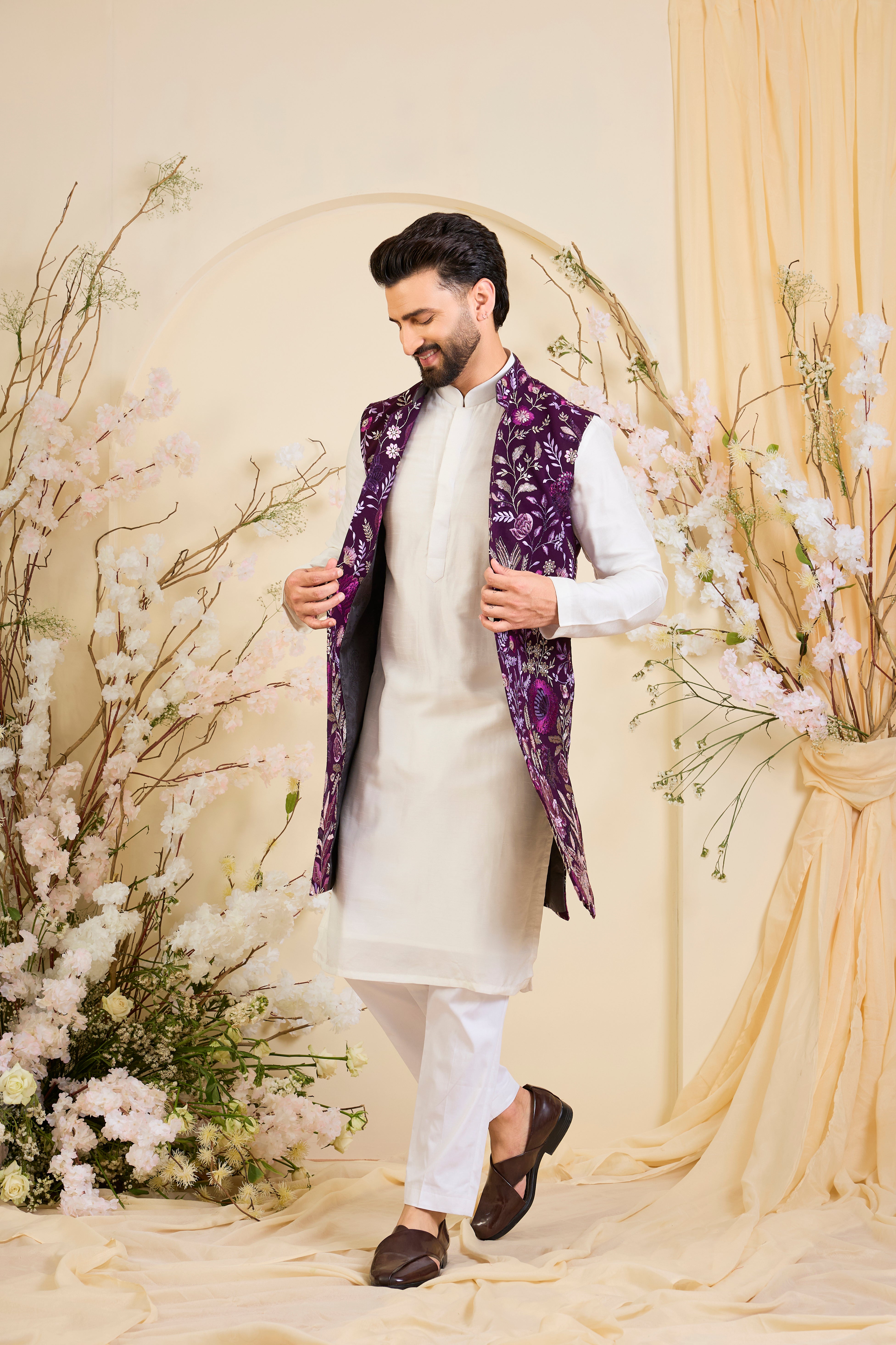 Purple long open jacket with intricate floral patterns in multi thread threadwork, elevated by detailed sequin embellishments for a refined, statement look.
