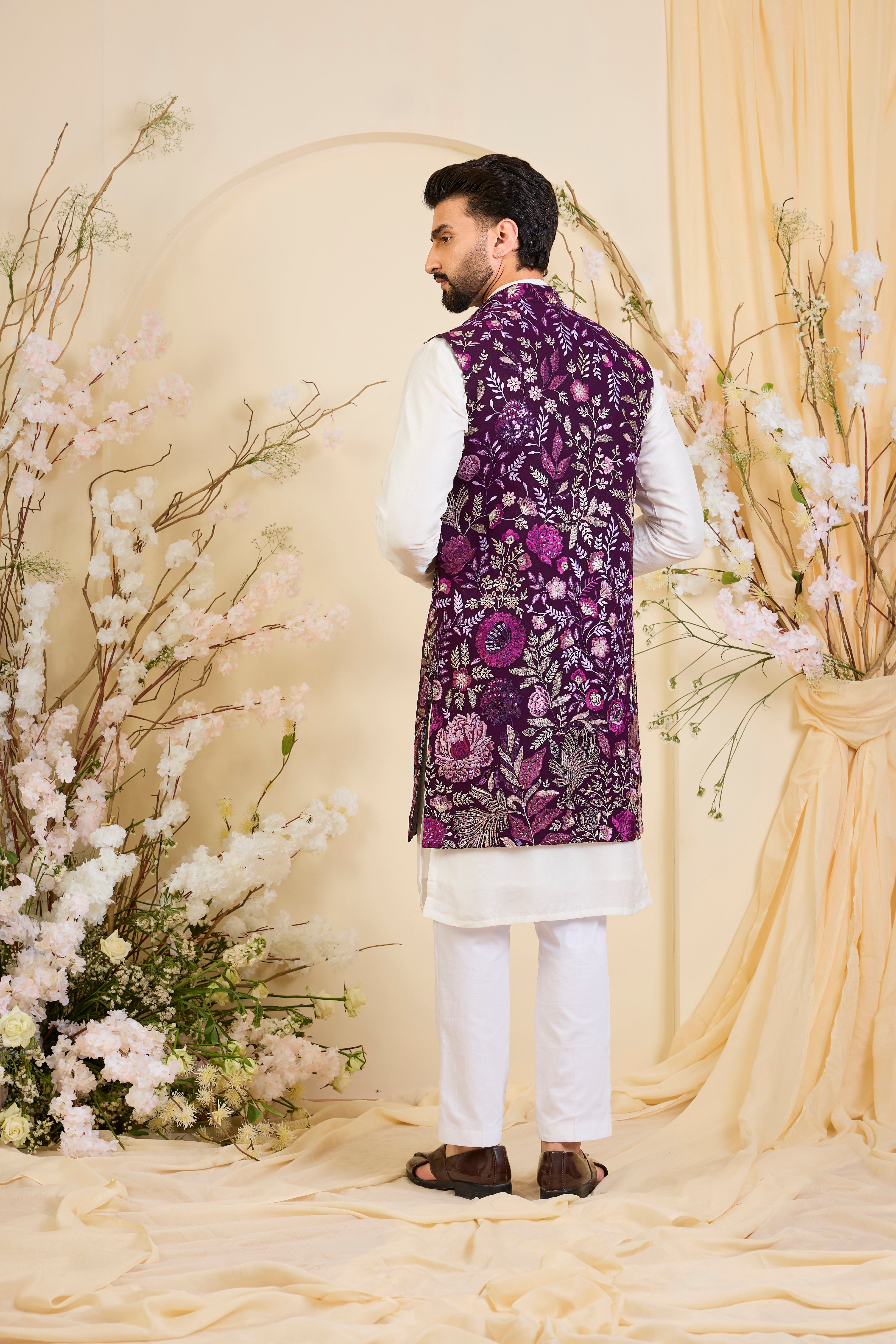 Purple long open jacket with intricate floral patterns in multi thread threadwork, elevated by detailed sequin embellishments for a refined, statement look.
