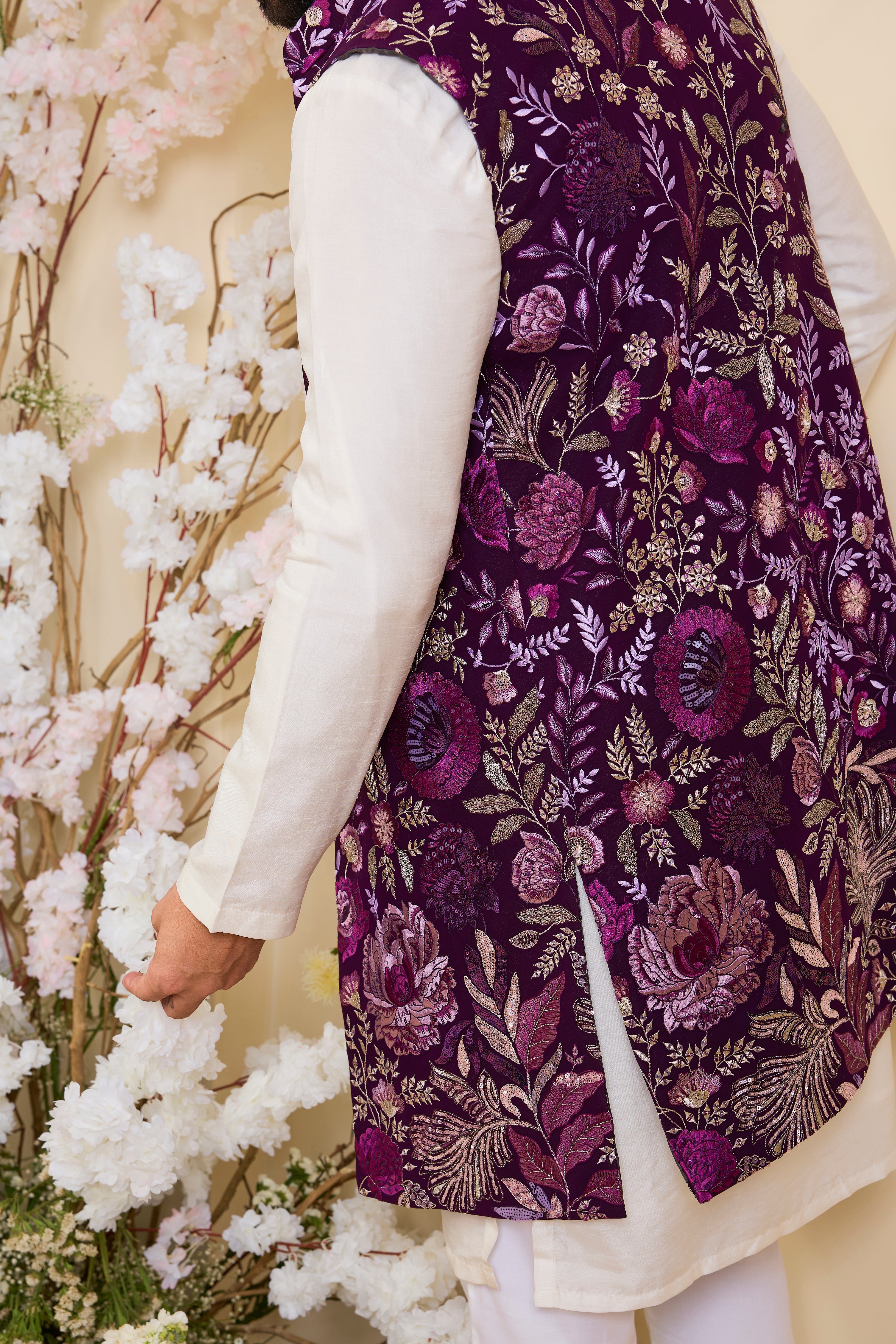 Purple long open jacket with intricate floral patterns in multi thread threadwork, elevated by detailed sequin embellishments for a refined, statement look.