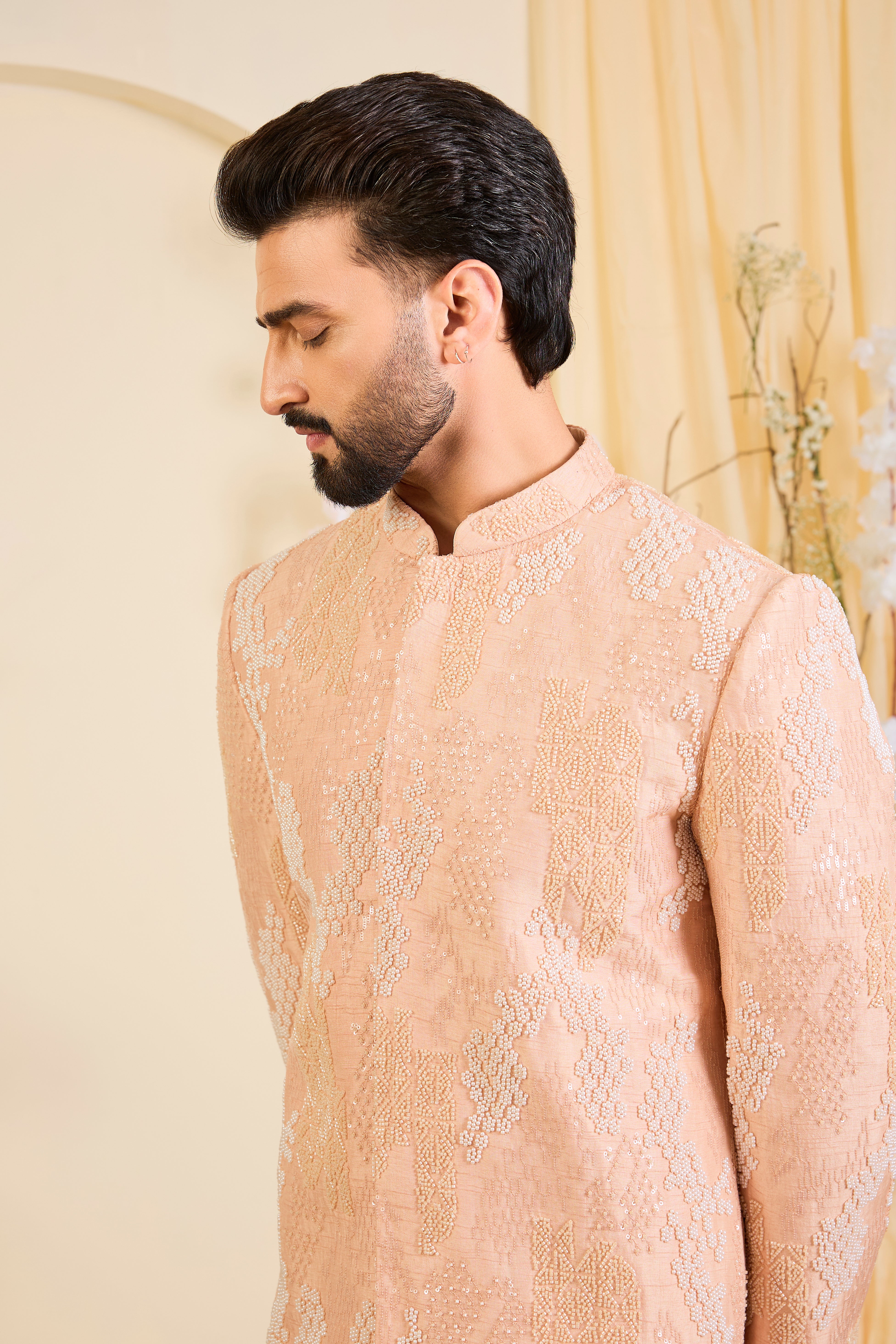 Peach hand-embroidered sherwani with tonal peach and ivory cut dana work, offering a refined, luminous, and impeccably formal couture statement.