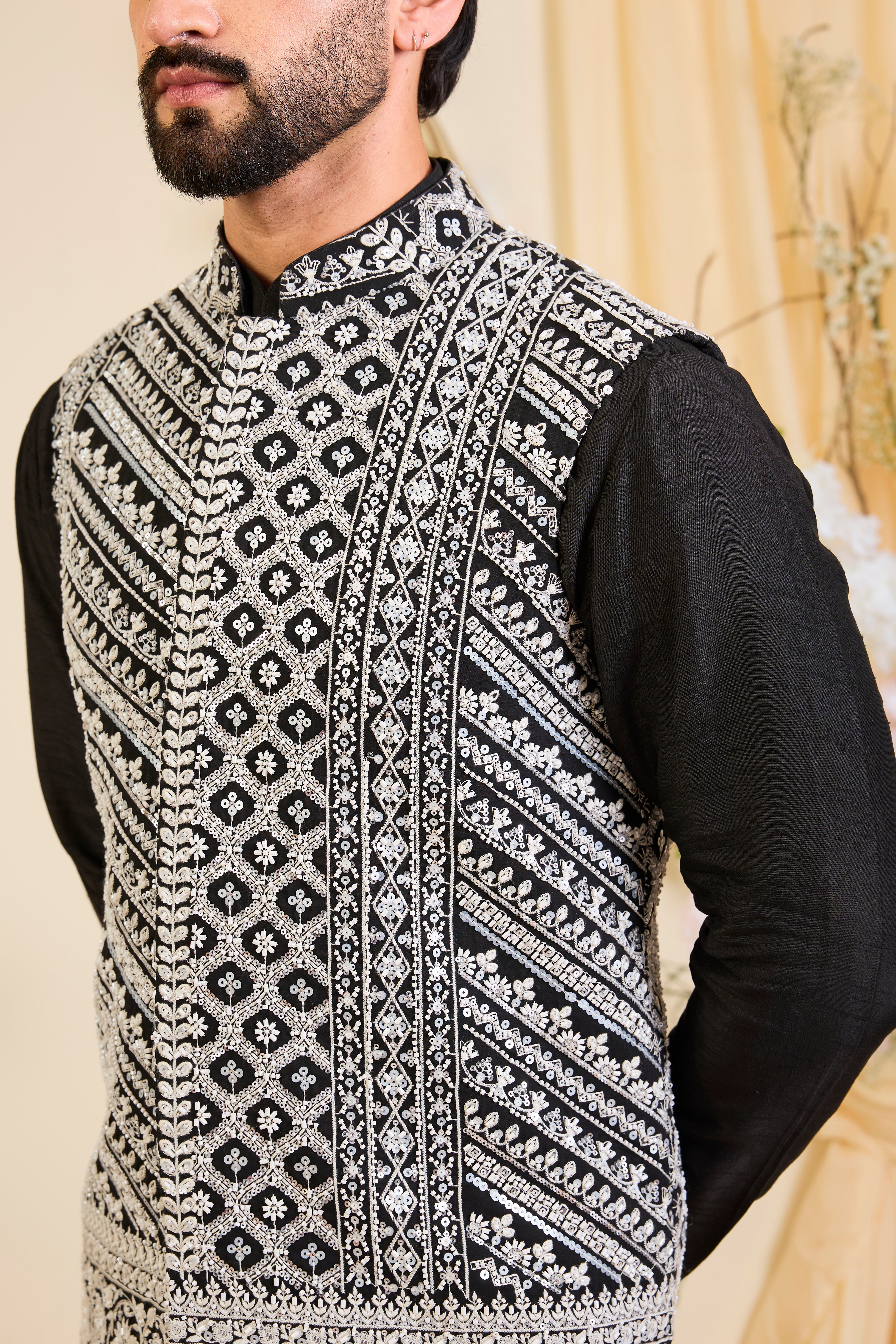 Black Nehru jacket with hand embroidery and delicate ivory cut dana work, offering a luminous, and refined couture expression.