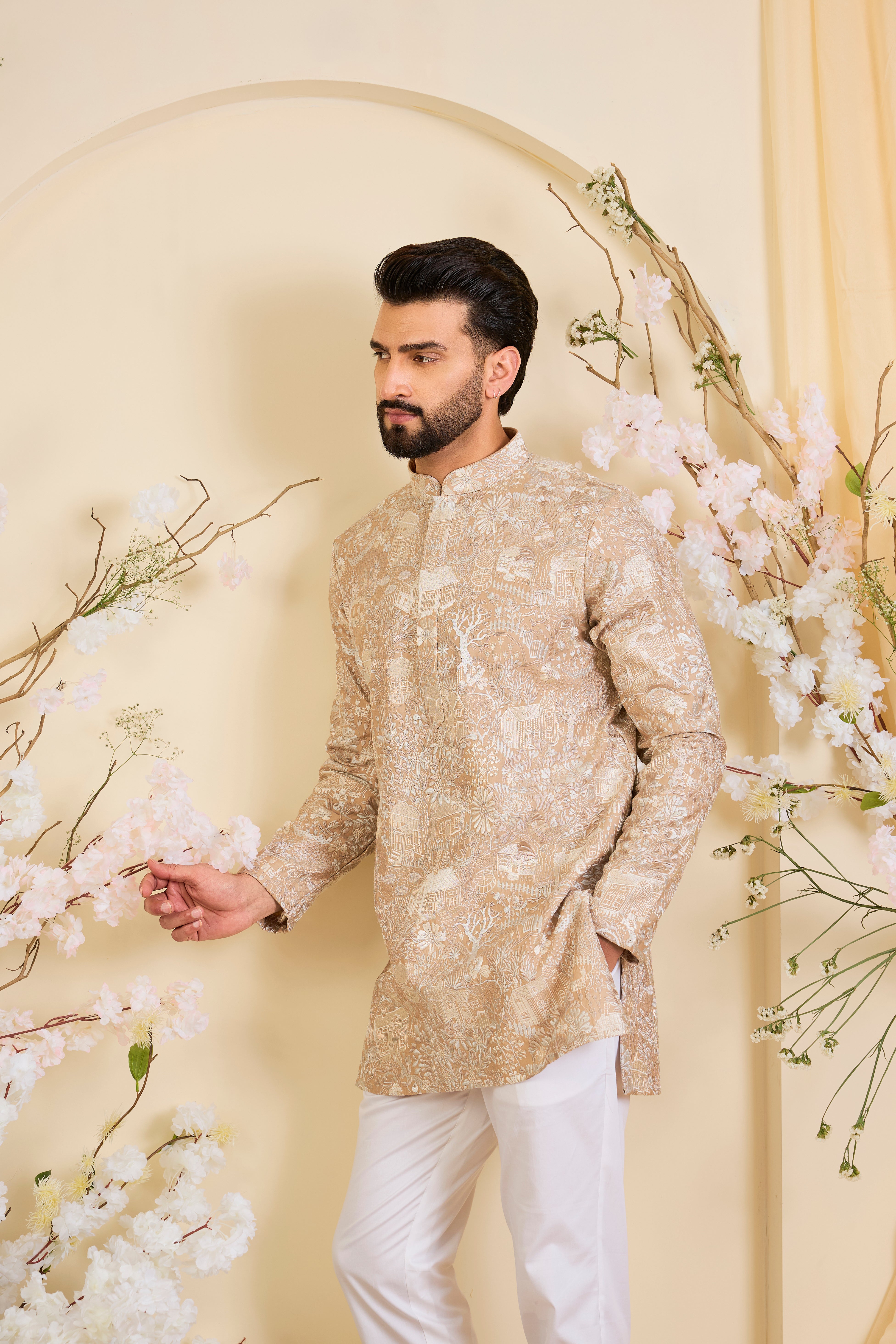 Dark beige/ dust pink short kurta with intricate flora-fauna embroidery and dense threadwork, offering a refined, richly textured couture statement.