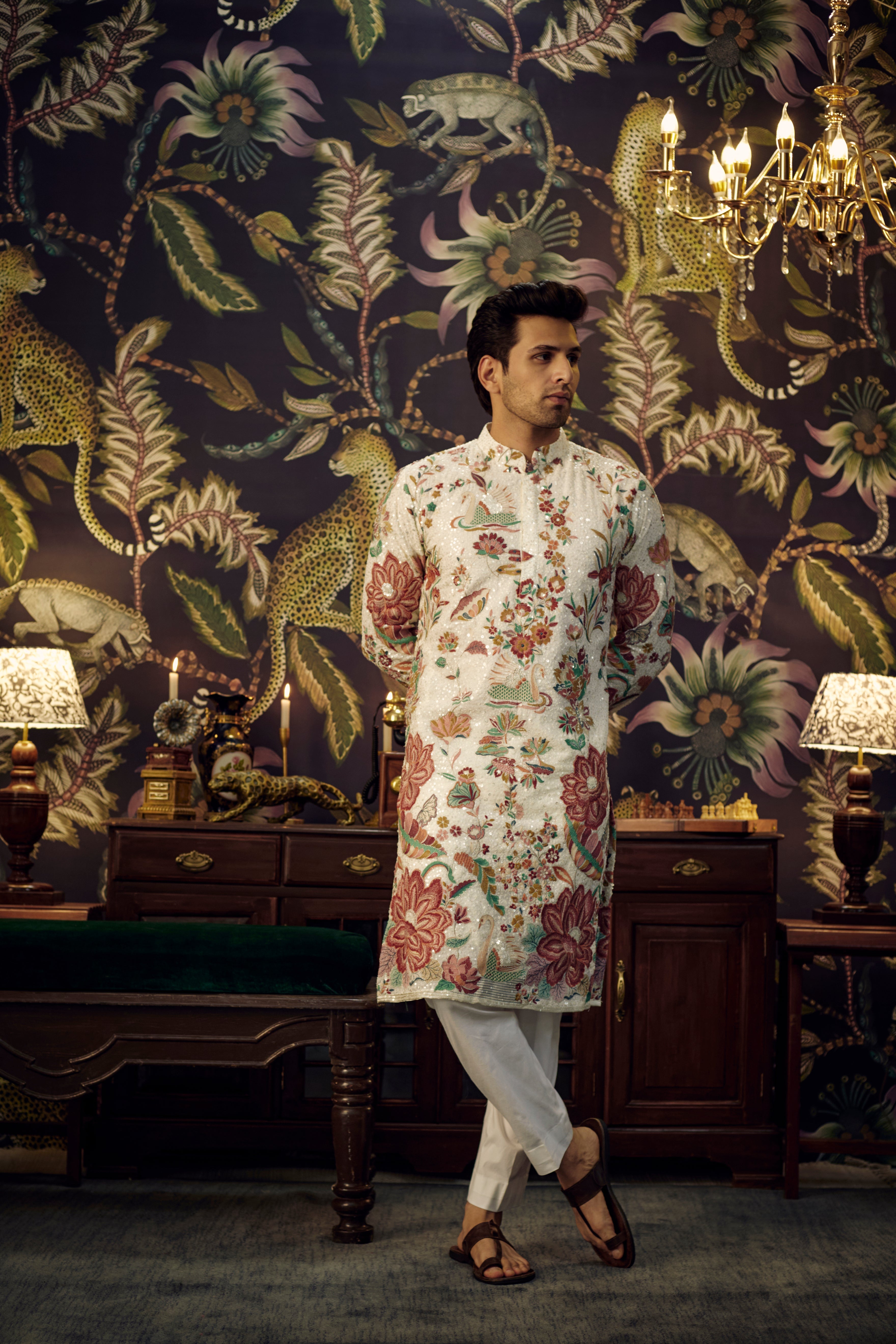 White sequined kurta showcasing detailed flora and fauna motif. - kasbahmen