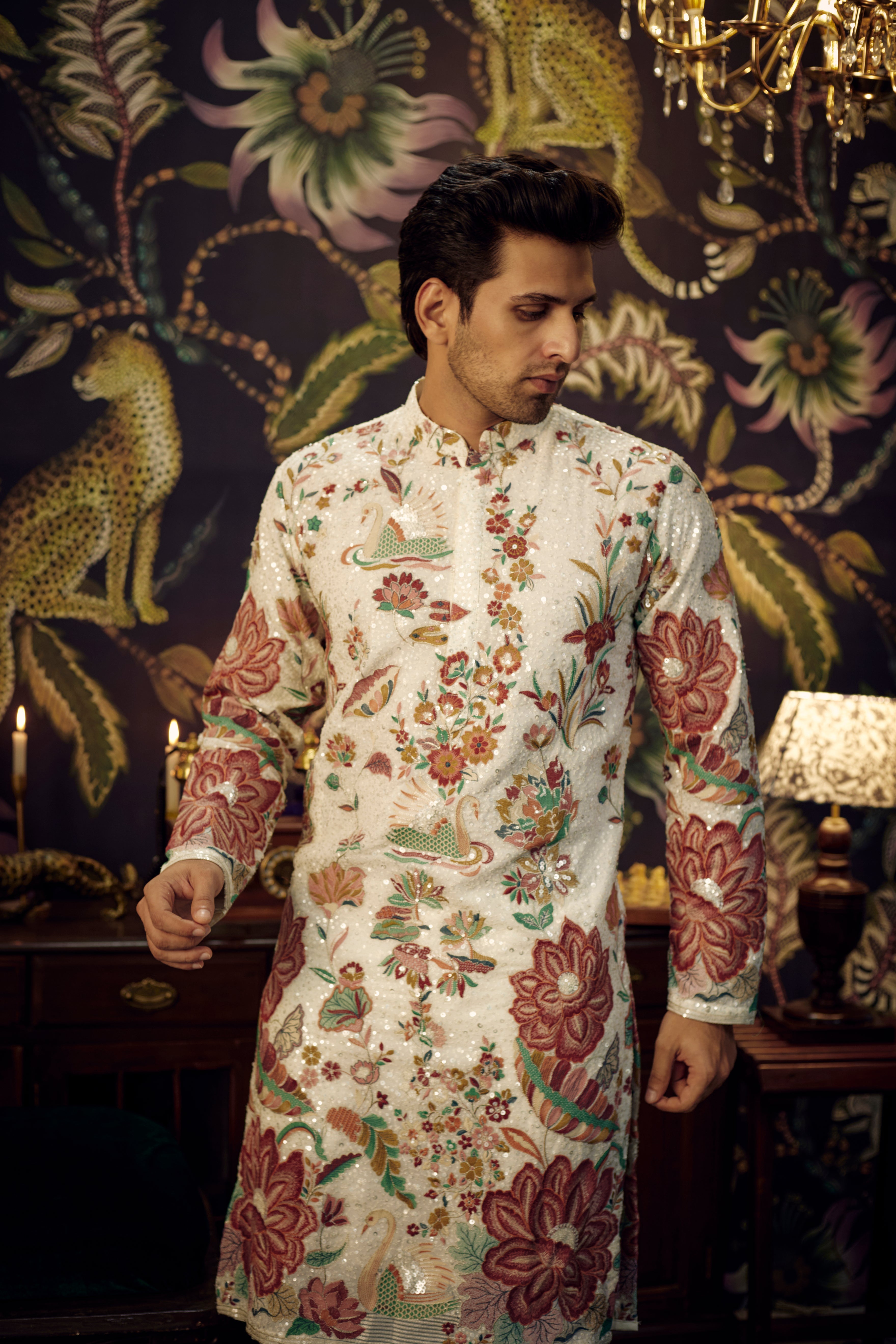 White sequined kurta showcasing detailed flora and fauna motif. - kasbahmen