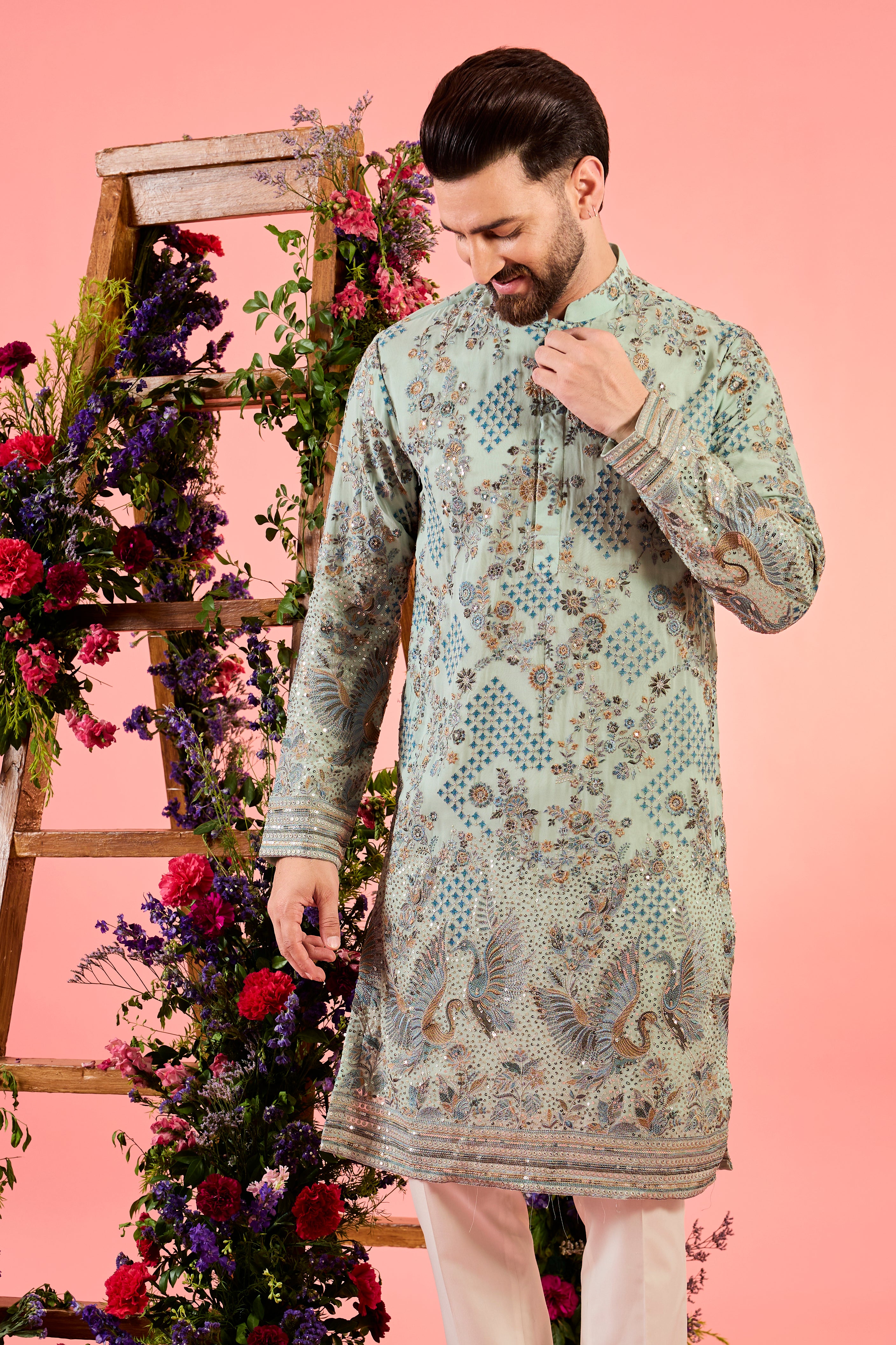 green chikankari kurta with intricate flora and fauna embroidery