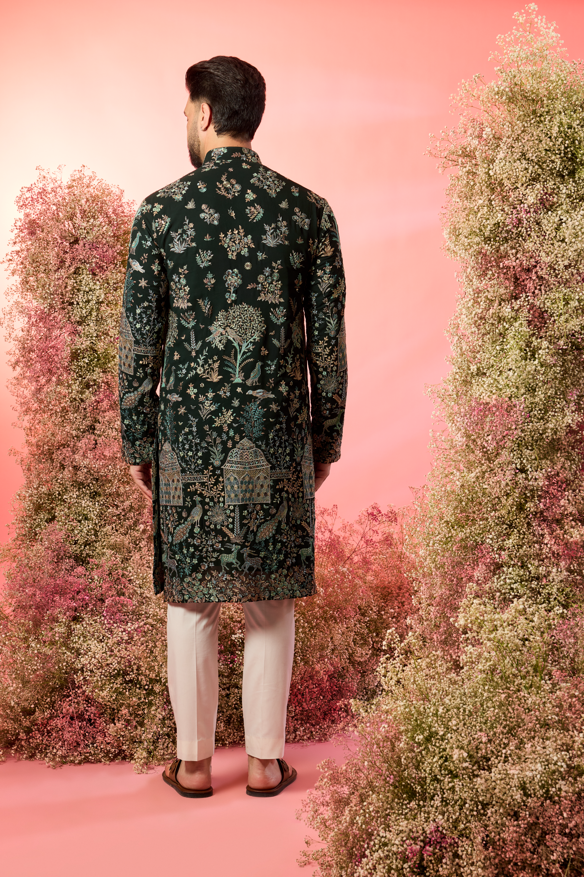 green chinakari kurta with intricate flora and fauna embroidery