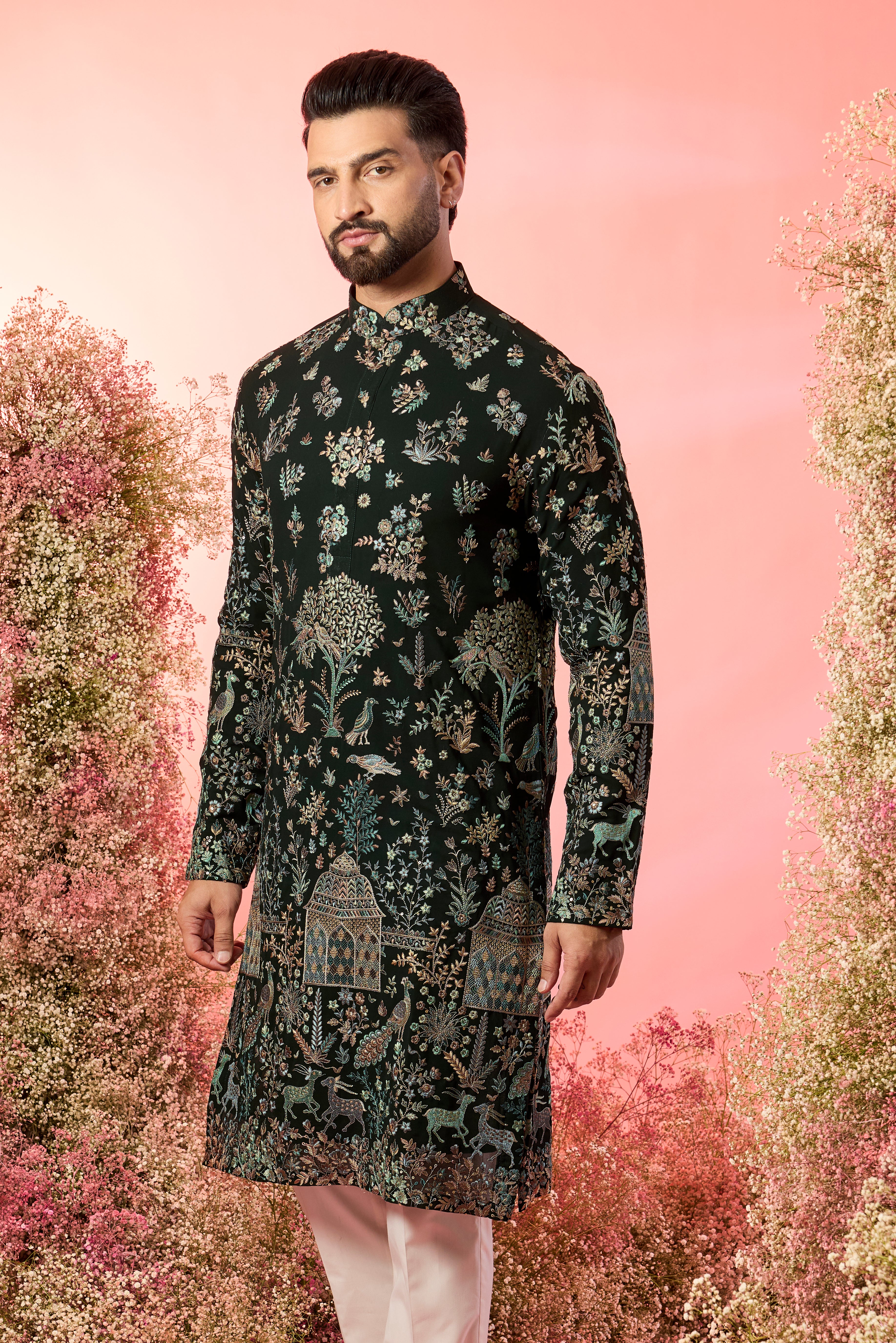green chinakari kurta with intricate flora and fauna embroidery