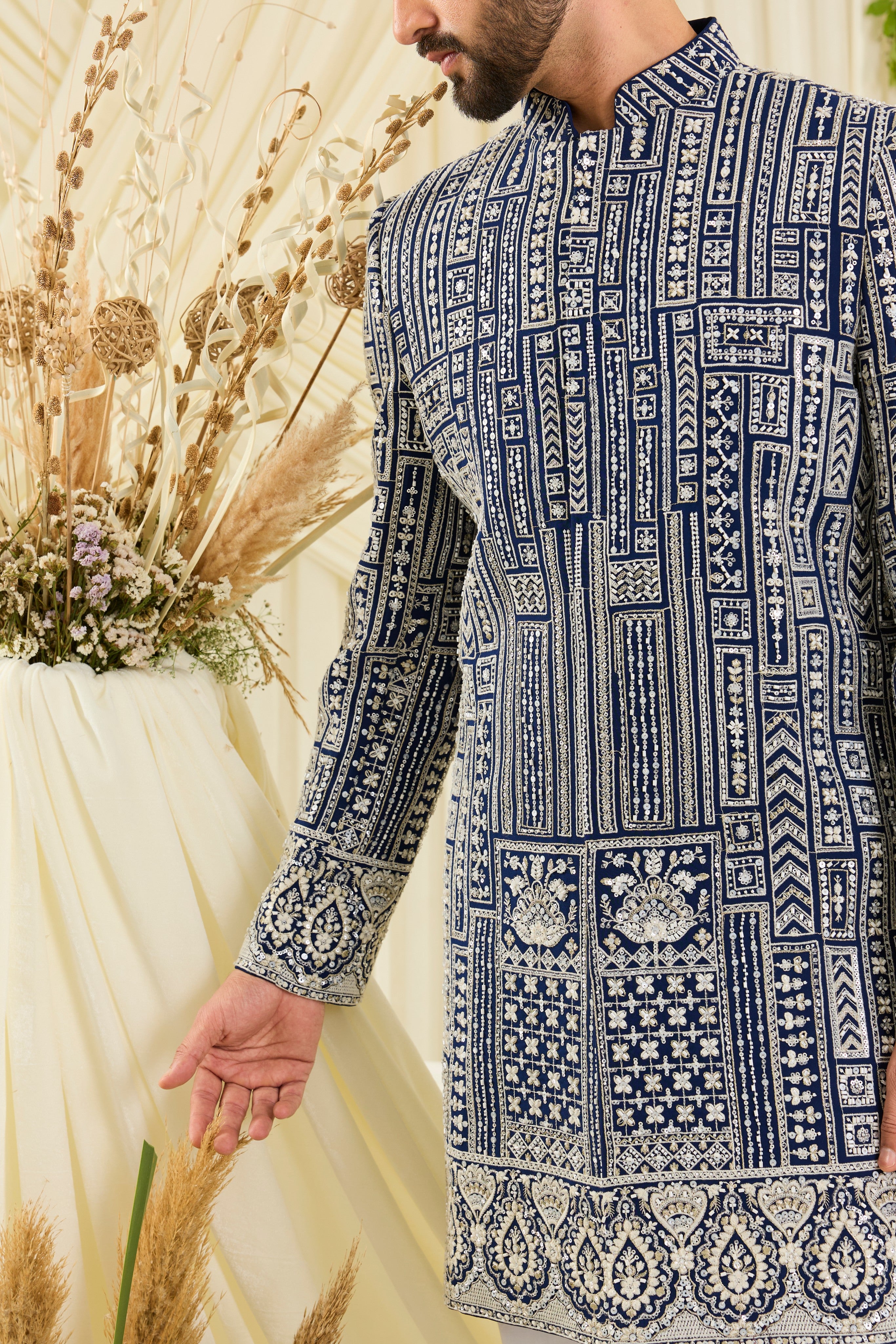 Royal blue short sherwani with intricate white cut dana work and delicate sequins, crafted for a bold, ultra-luxurious statement.