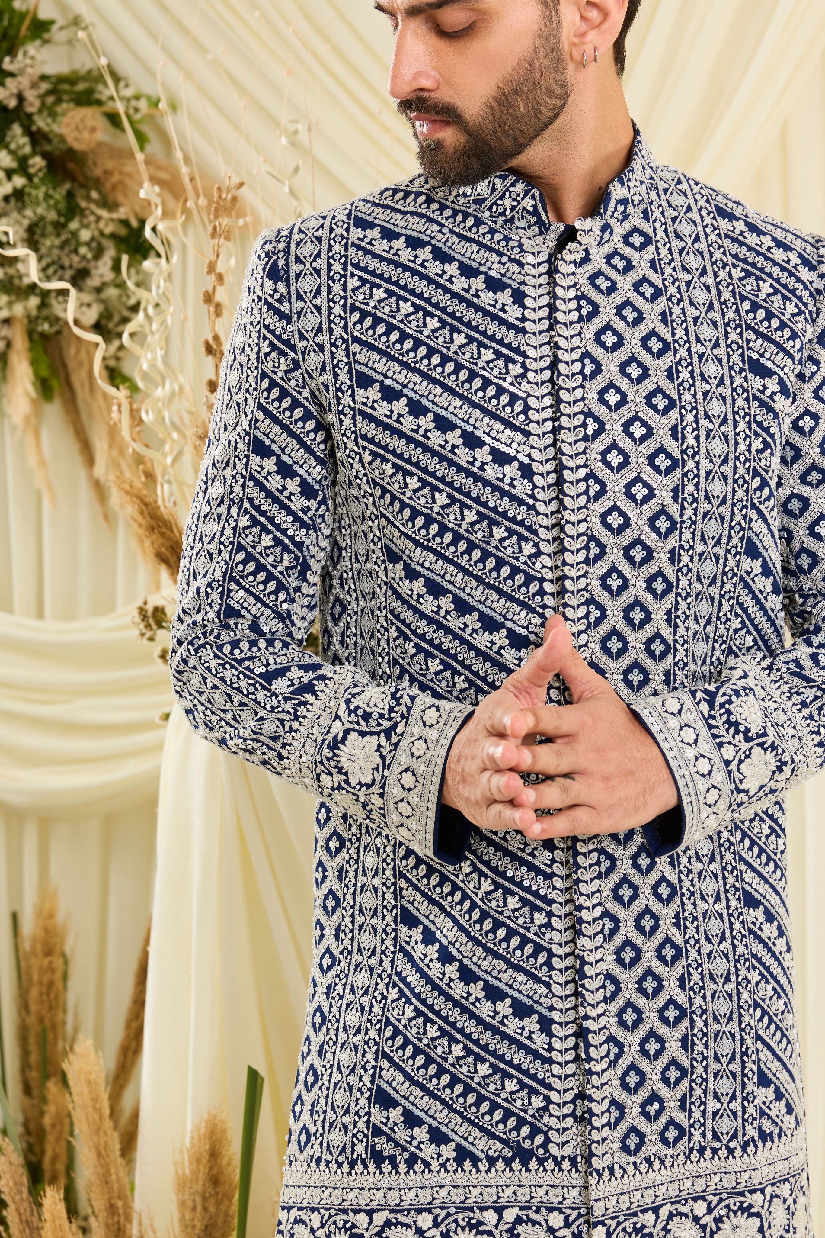 Royal blue short sherwani with intricate white cut dana work and delicate sequins, crafted for a bold, ultra-luxurious statement.
