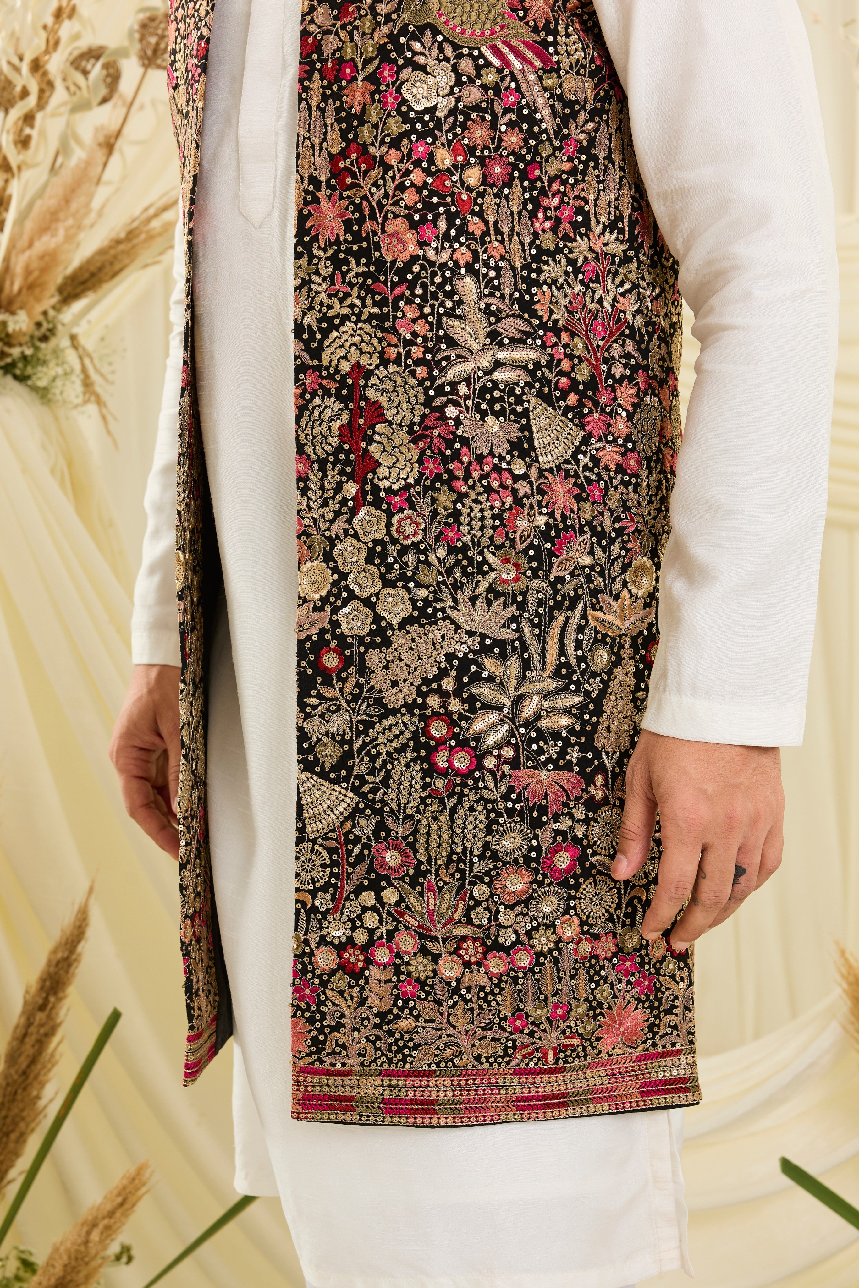 Black long open jacket with flora-fauna embroidery, multicolour threadwork, and delicate sequins for a rich, elevated couture statement.