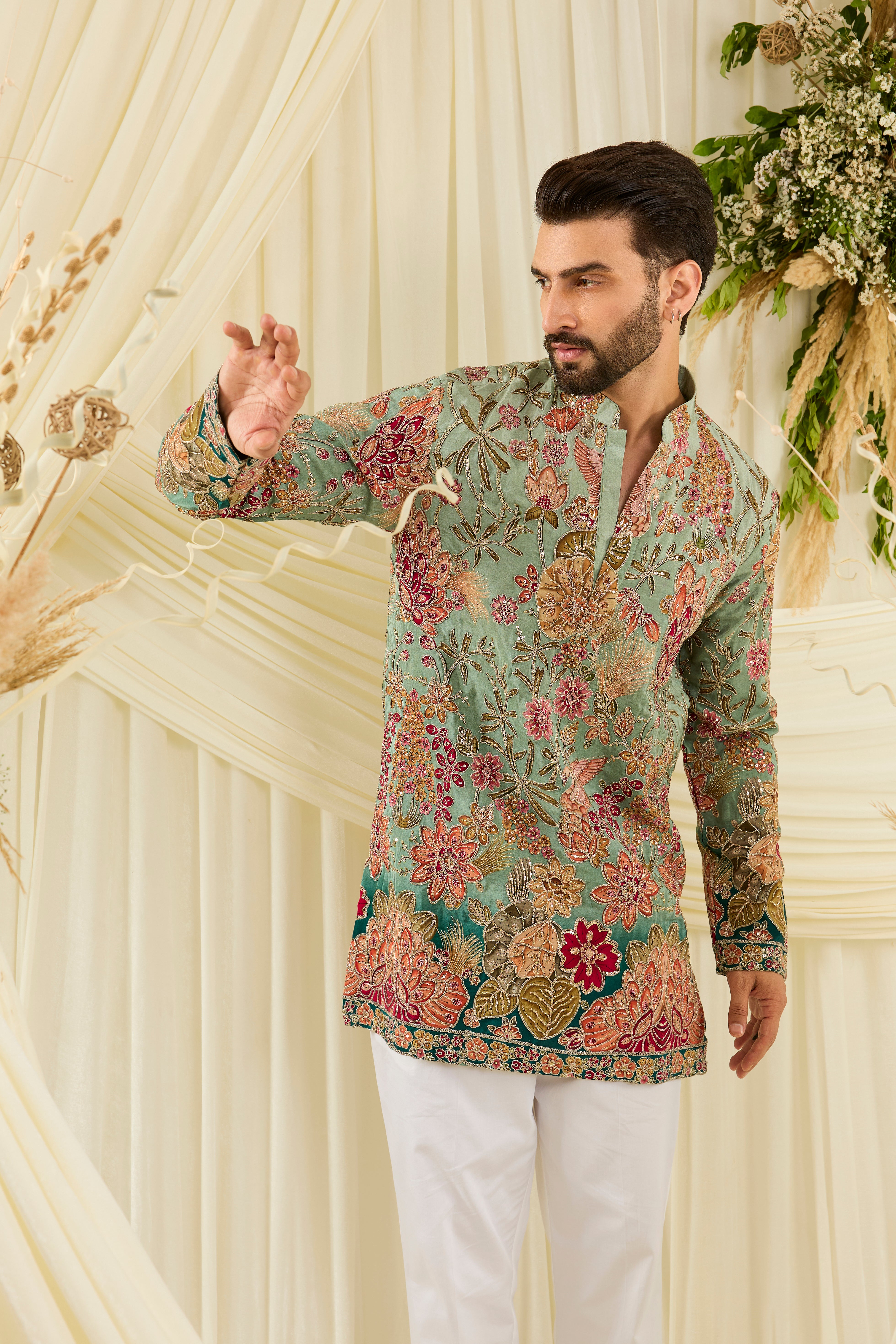 Pastel  blue/aqua short kurta with intricate floral embroidery, rich zari detailing, and delicate sequins for a refined, luminous festive statement.