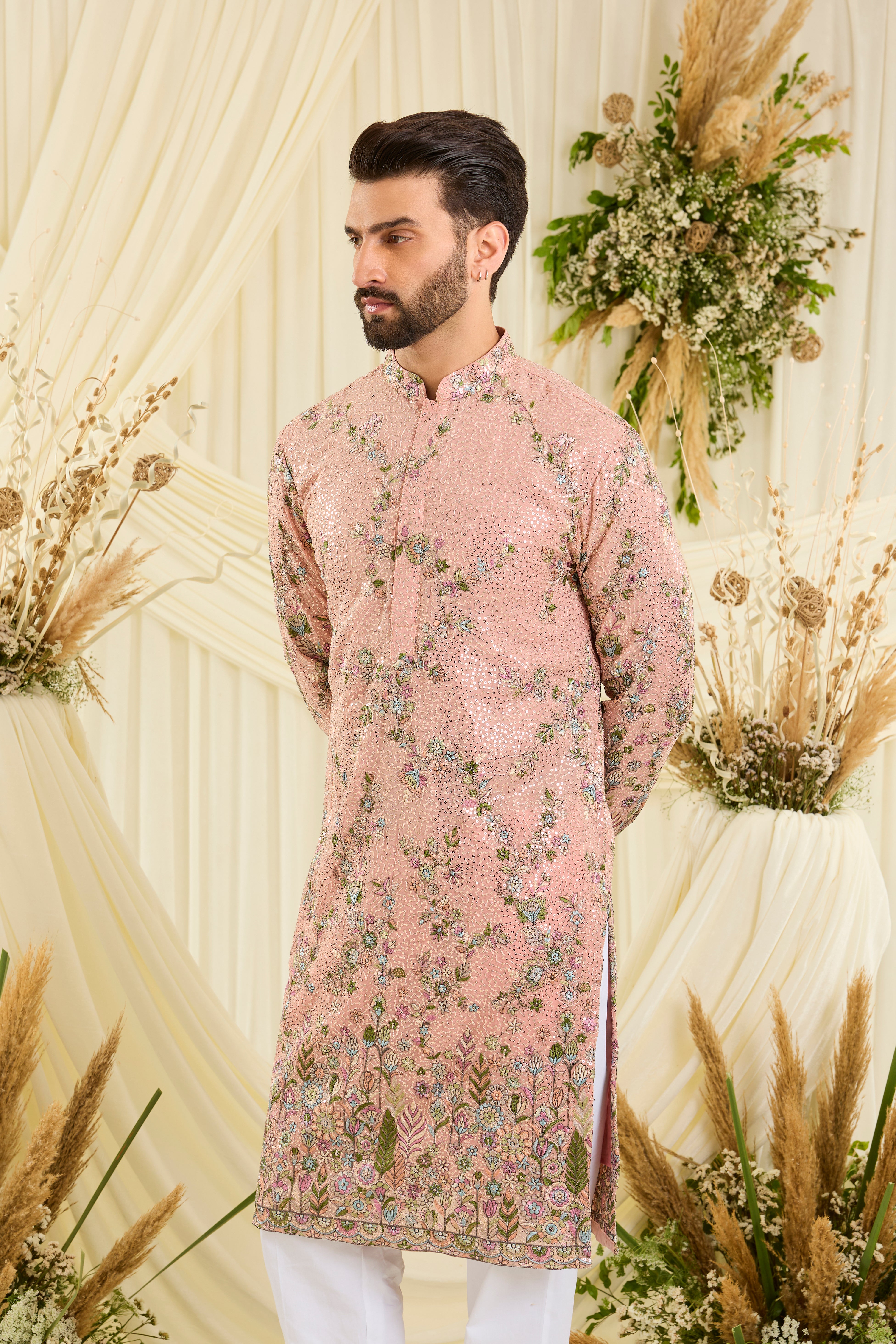 Light peach sequined kurta with intricate floral embroidery, multicolour threadwork, and delicate sequins for a fresh, elevated festive look.
