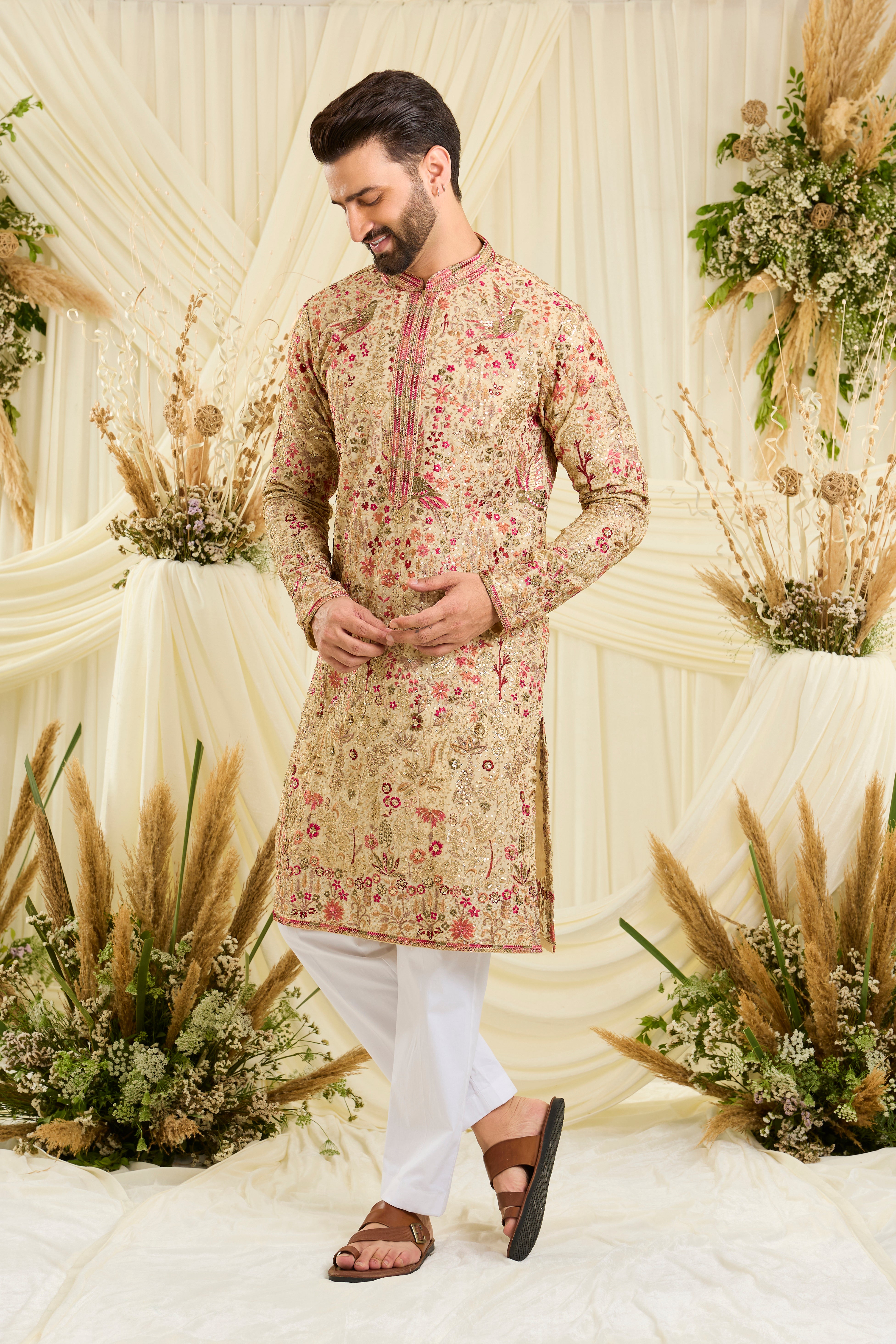 Cream- gold sequined  kurta with intricate flora-fauna embroidery, multicolour threadwork, sequins, and a delicately detailed neckline for elevated festive elegance