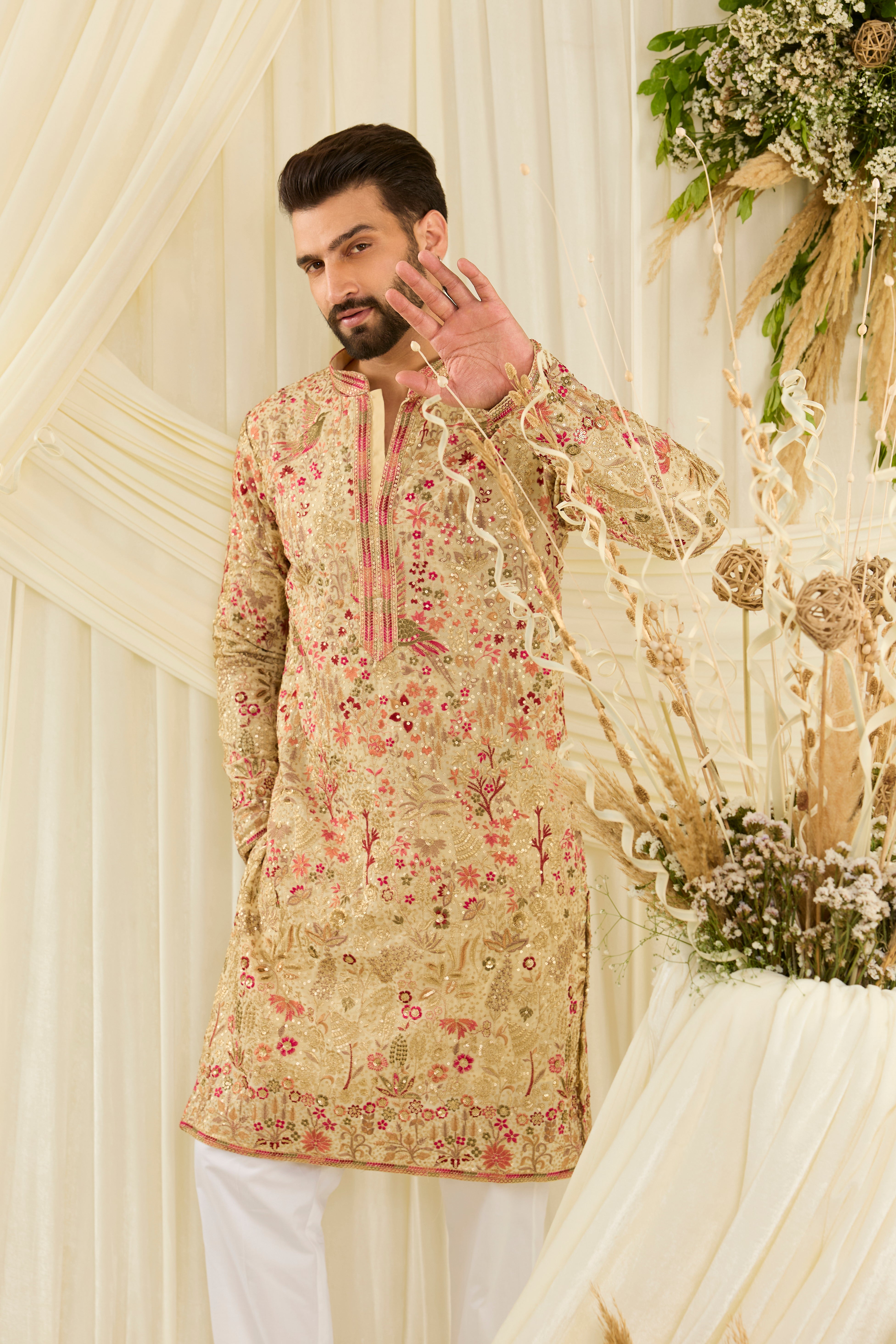 Cream- gold sequined  kurta with intricate flora-fauna embroidery, multicolour threadwork, sequins, and a delicately detailed neckline for elevated festive elegance