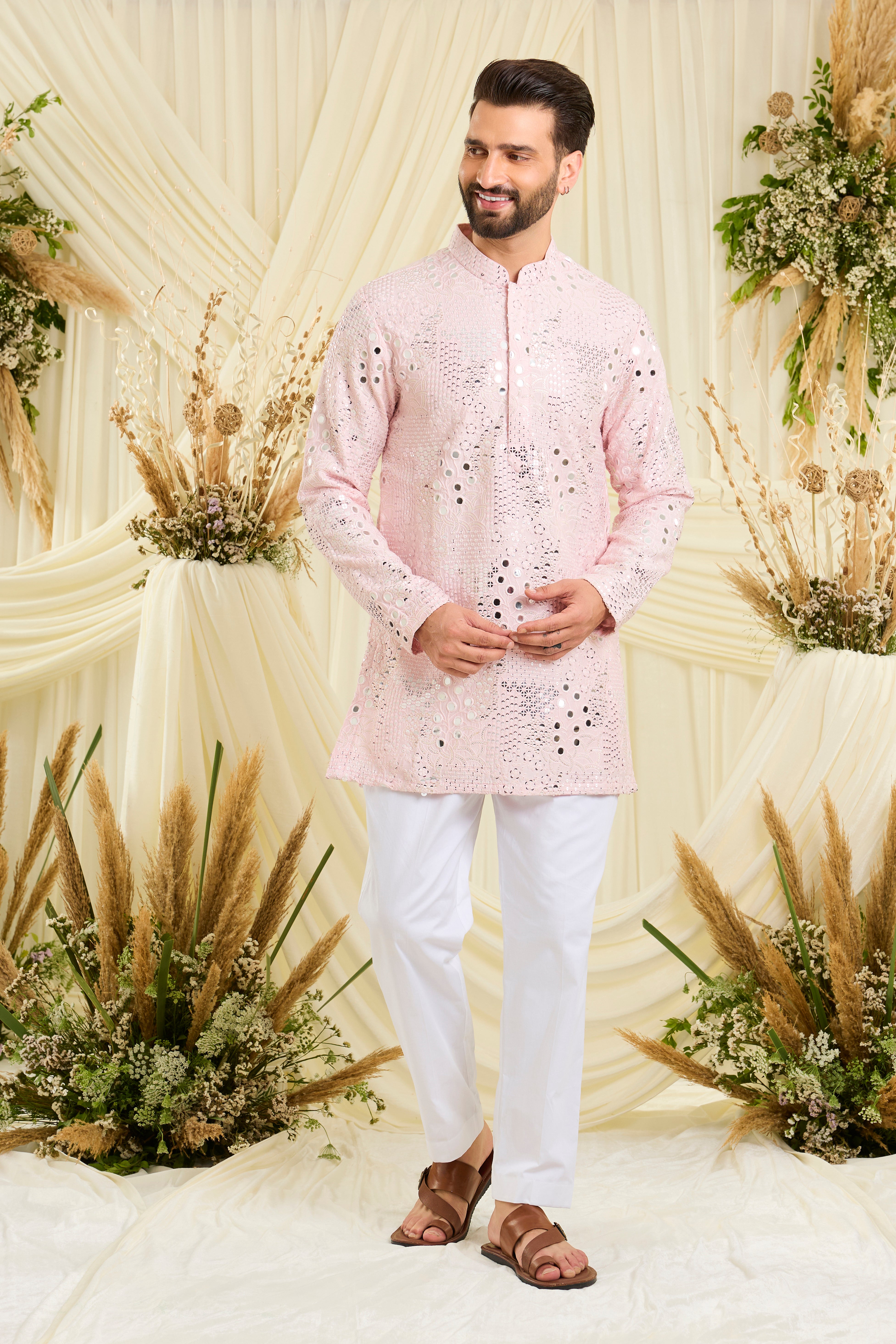 Baby pink mirrorwork kurta with floral threadwork and shimmering sequins — luminous, romantic, and crafted to stand out.