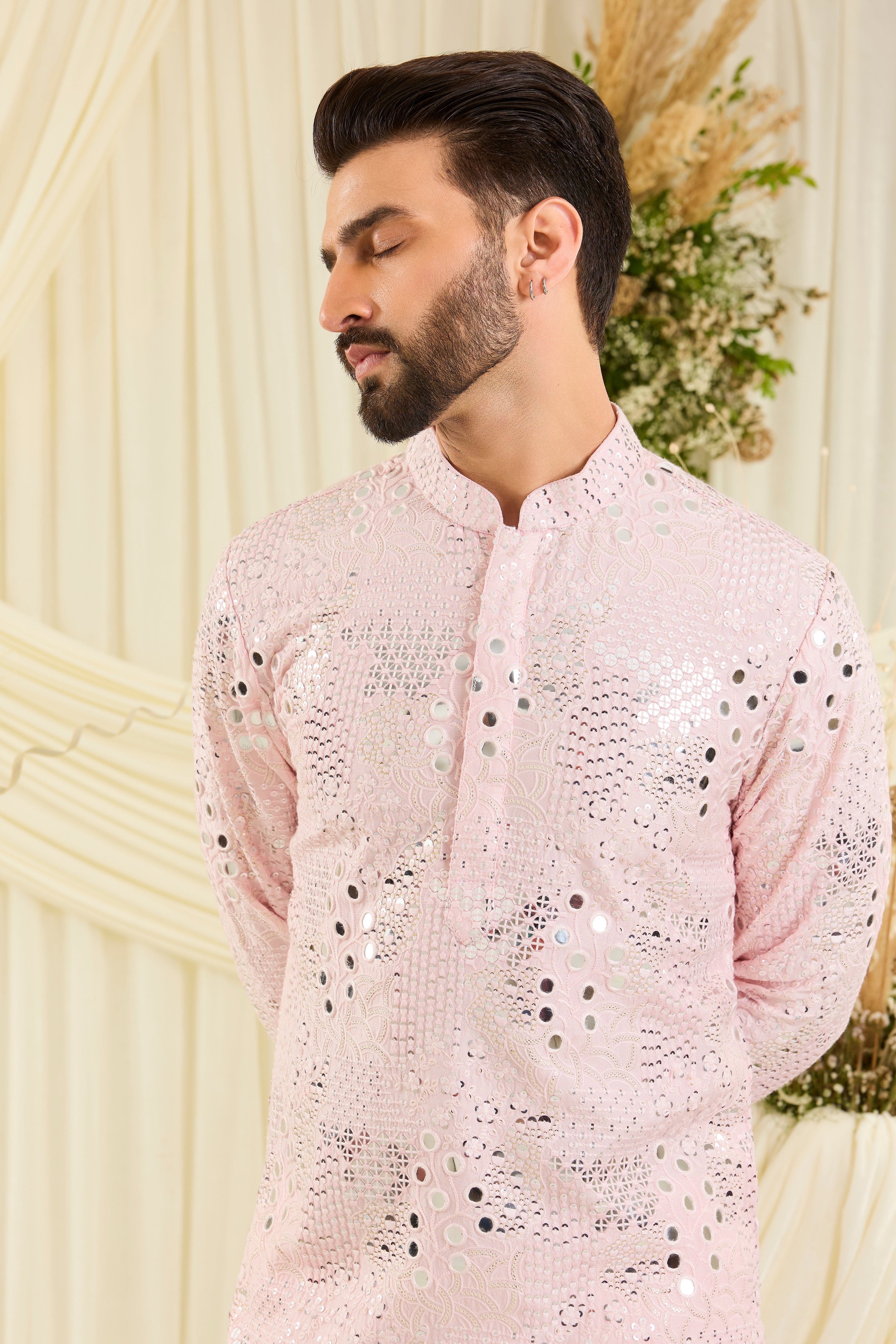 Baby pink mirrorwork kurta with floral threadwork and shimmering sequins — luminous, romantic, and crafted to stand out.