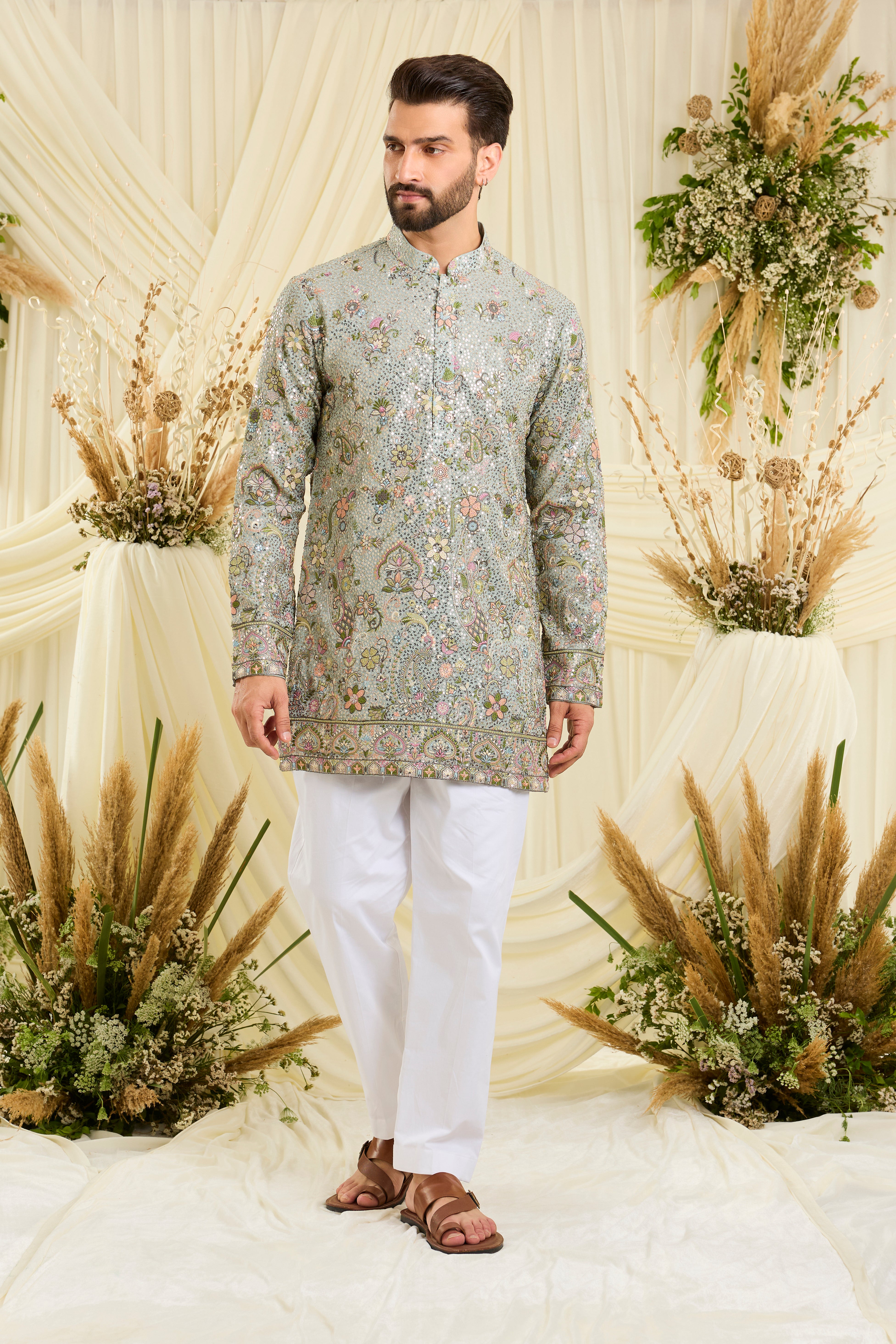 Blue sequined short  kurta with intricate floral embroidery, multicolour threadwork, and delicate sequins for a fresh, elevated festive look.