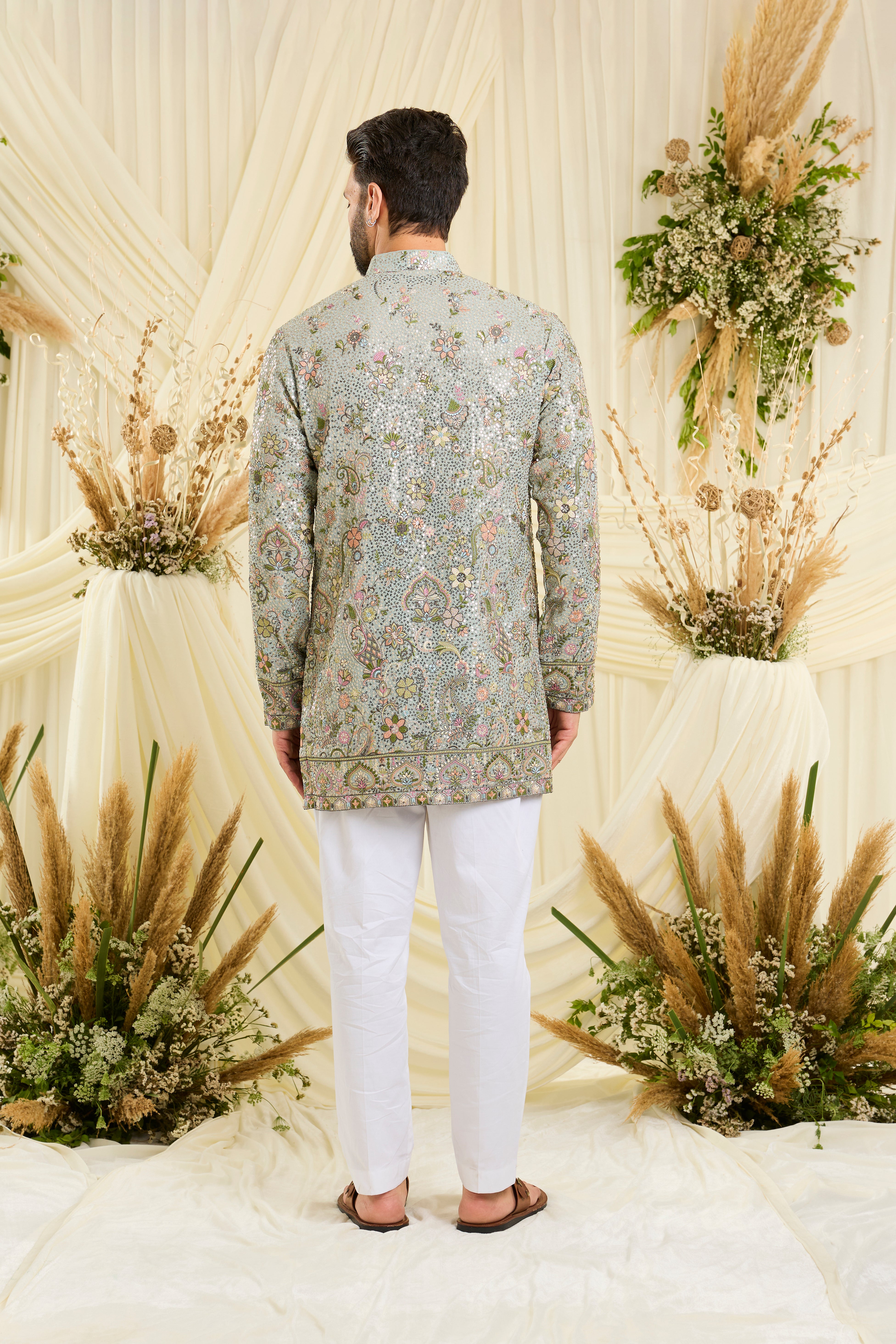 Blue sequined short  kurta with intricate floral embroidery, multicolour threadwork, and delicate sequins for a fresh, elevated festive look.