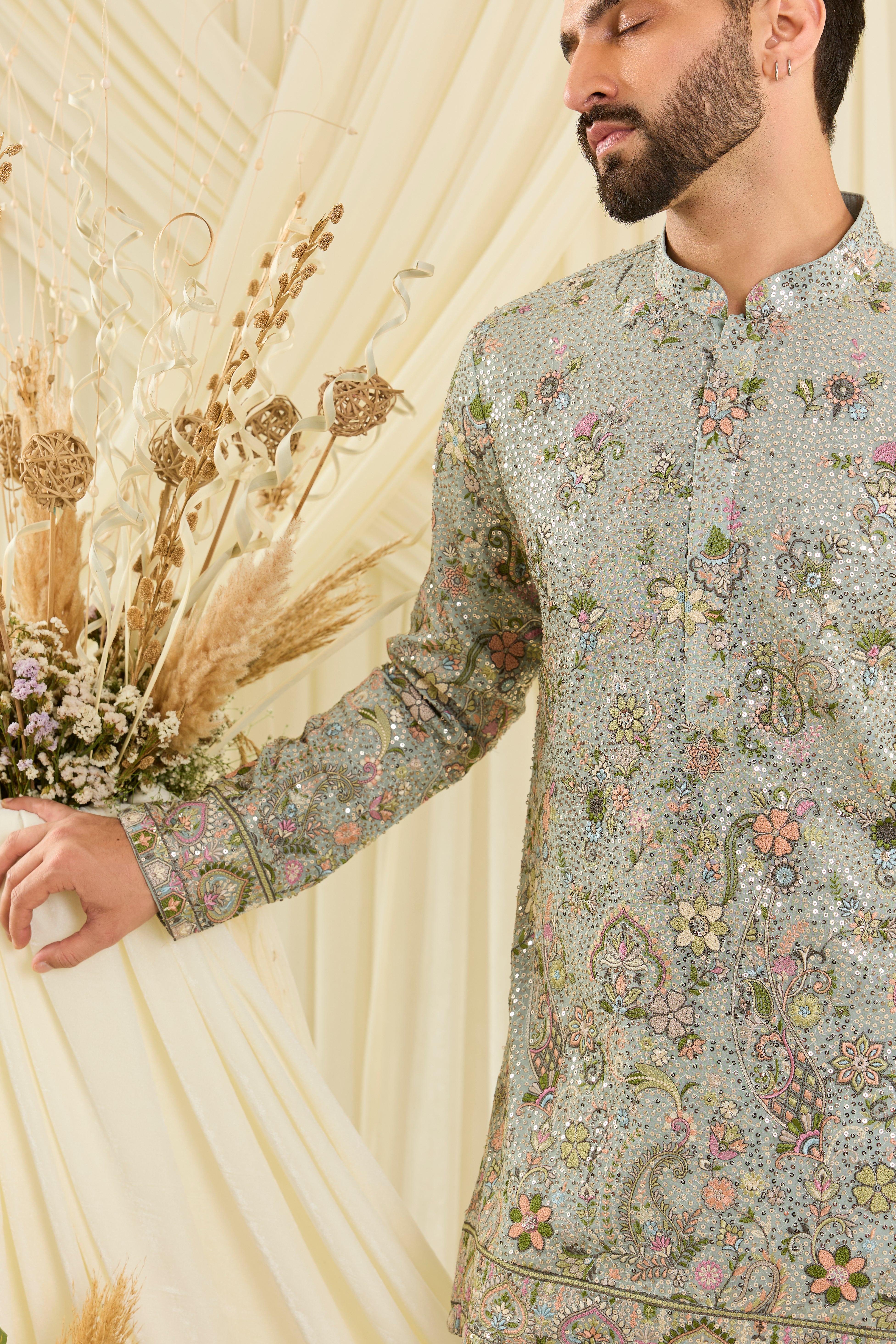 Blue sequined short  kurta with intricate floral embroidery, multicolour threadwork, and delicate sequins for a fresh, elevated festive look.