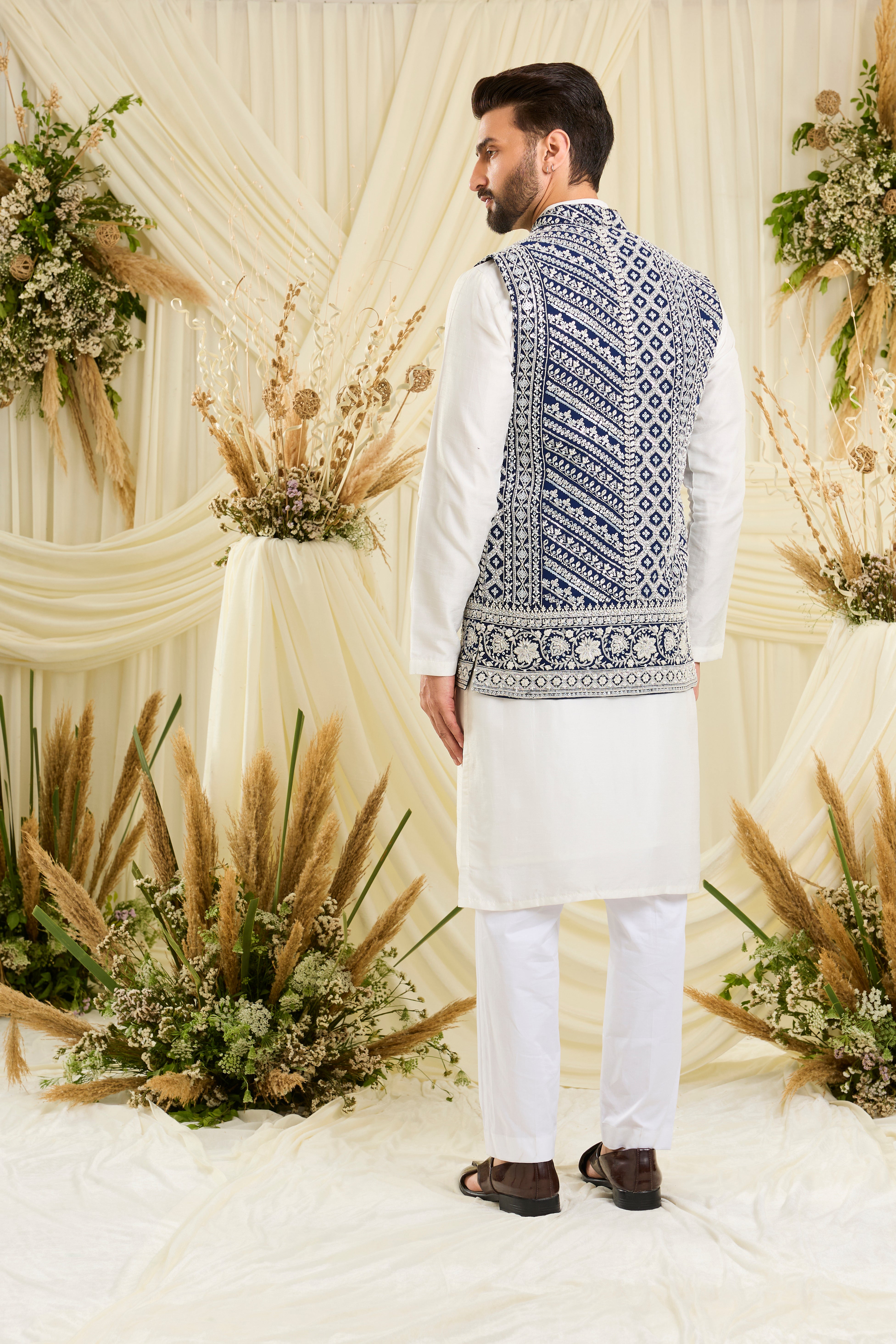 Royal blue nehru jacket with intricate white cut dana work and delicate sequins, crafted for a bold, ultra-luxurious statement.