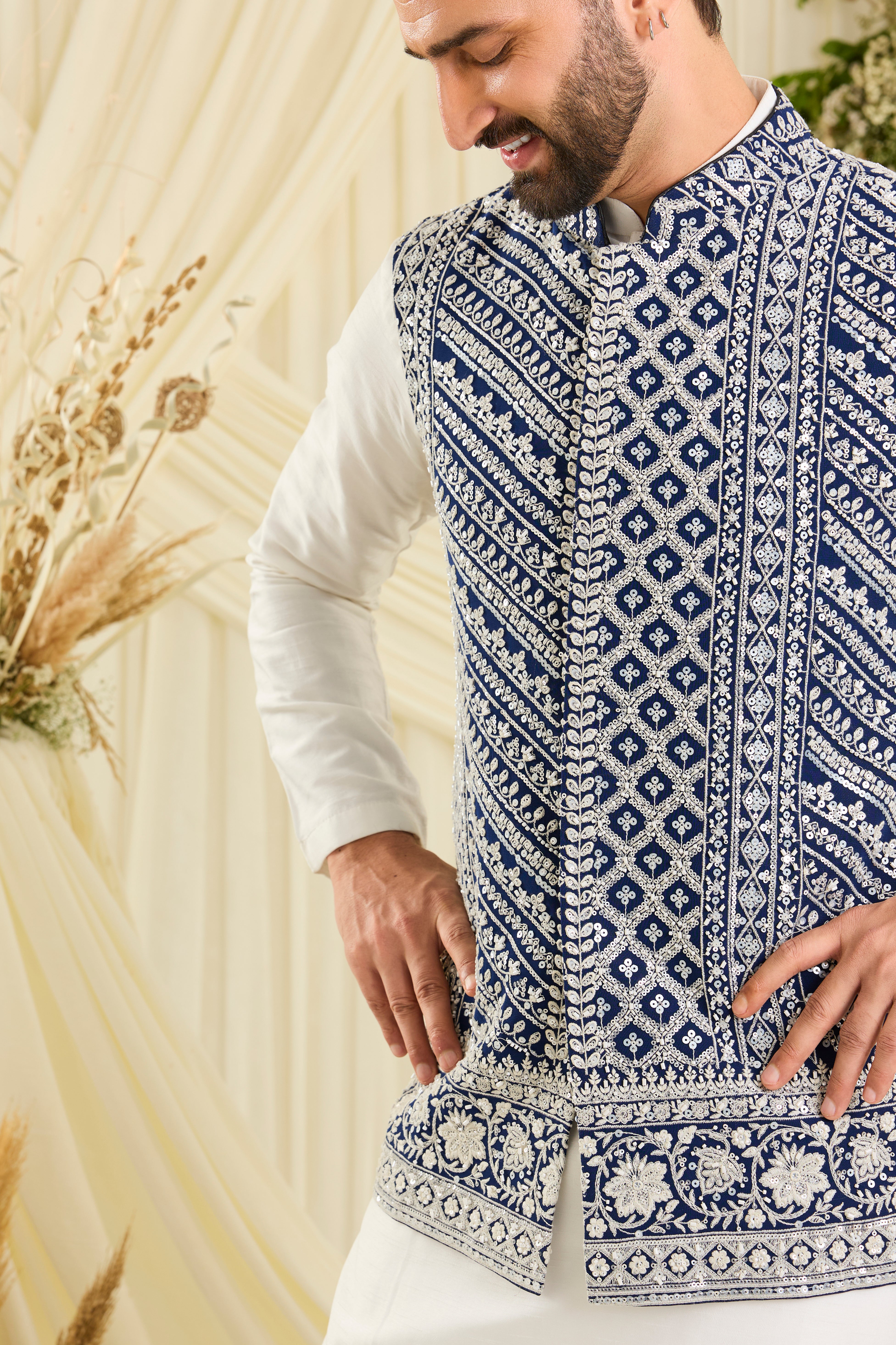 Royal blue nehru jacket with intricate white cut dana work and delicate sequins, crafted for a bold, ultra-luxurious statement.