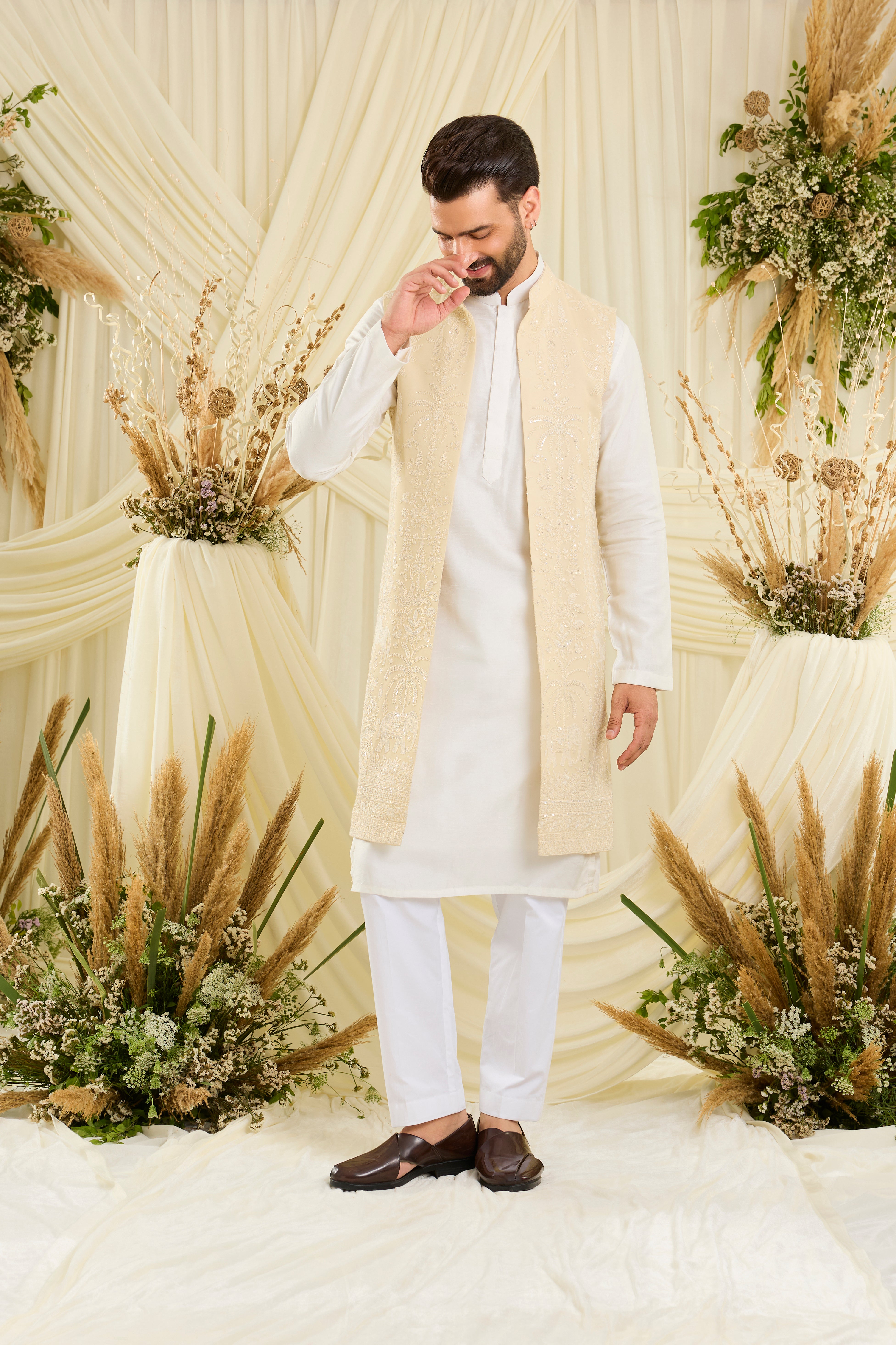 Yellow chikankari long jacket with ivory threadwork, flora-fauna embroidery, and delicate sequins for a refined, luminous couture statement.