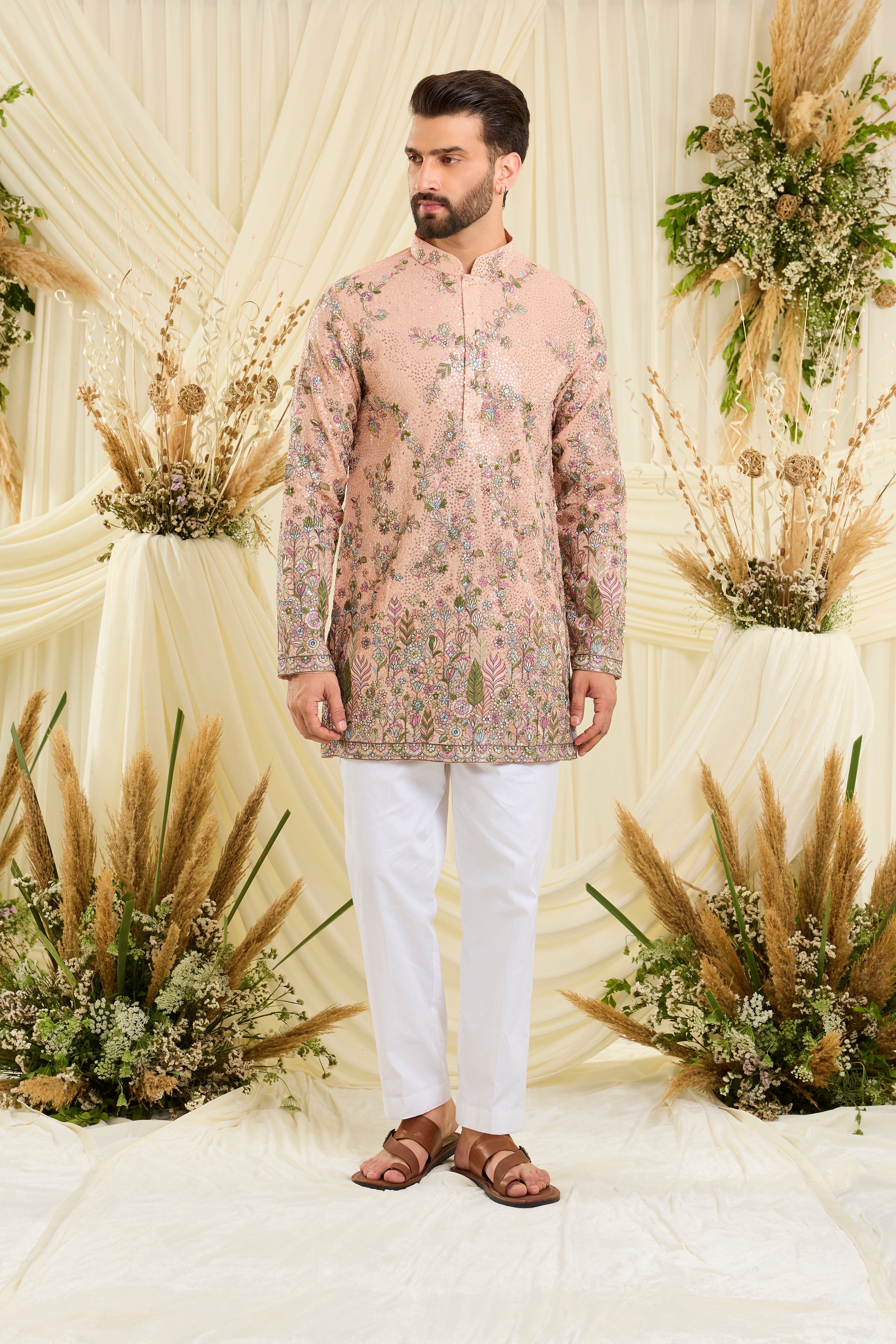 Peach sequined short  kurta with intricate floral embroidery, multicolour threadwork, and delicate sequins for a fresh, elevated festive look.