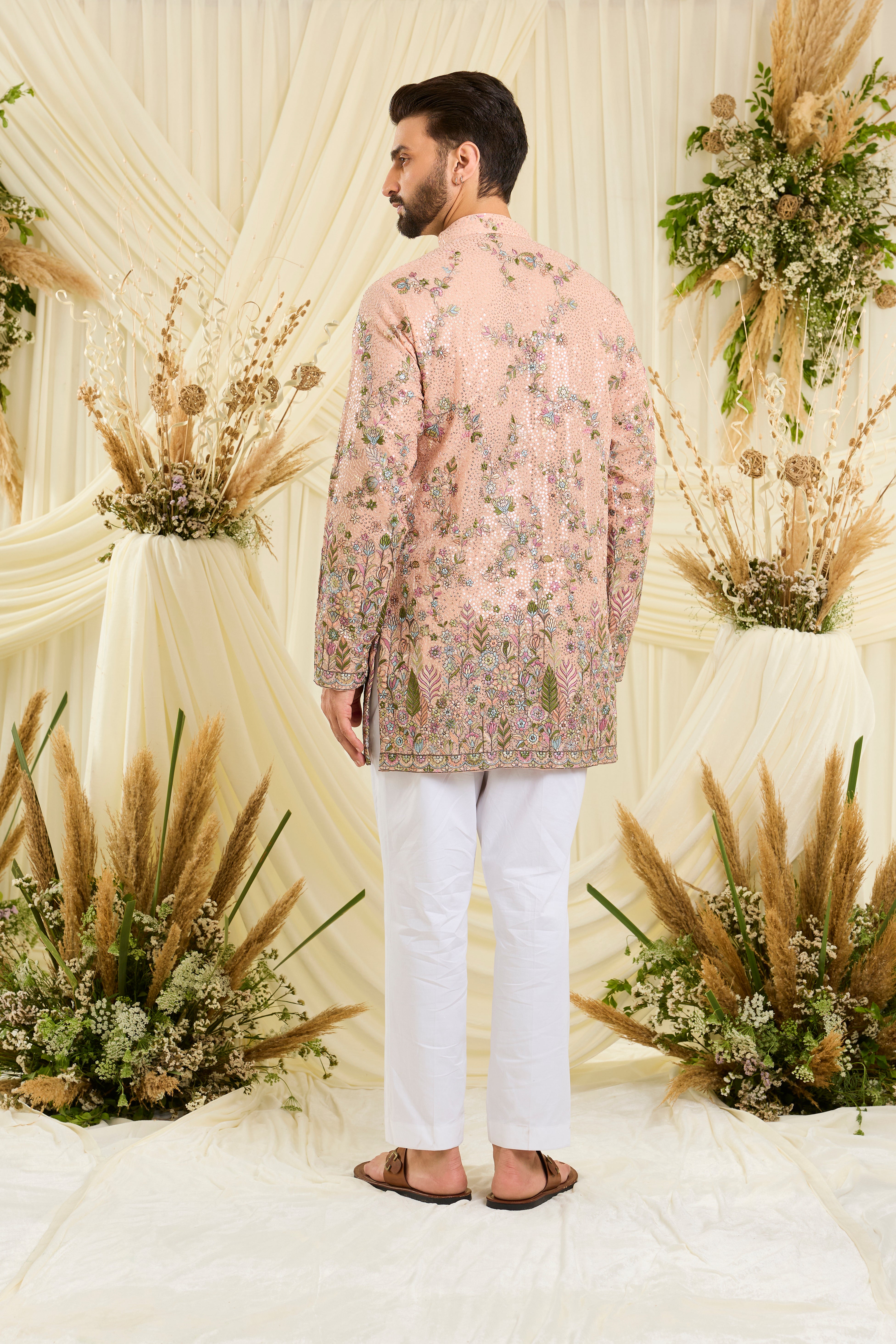 Peach sequined short  kurta with intricate floral embroidery, multicolour threadwork, and delicate sequins for a fresh, elevated festive look.