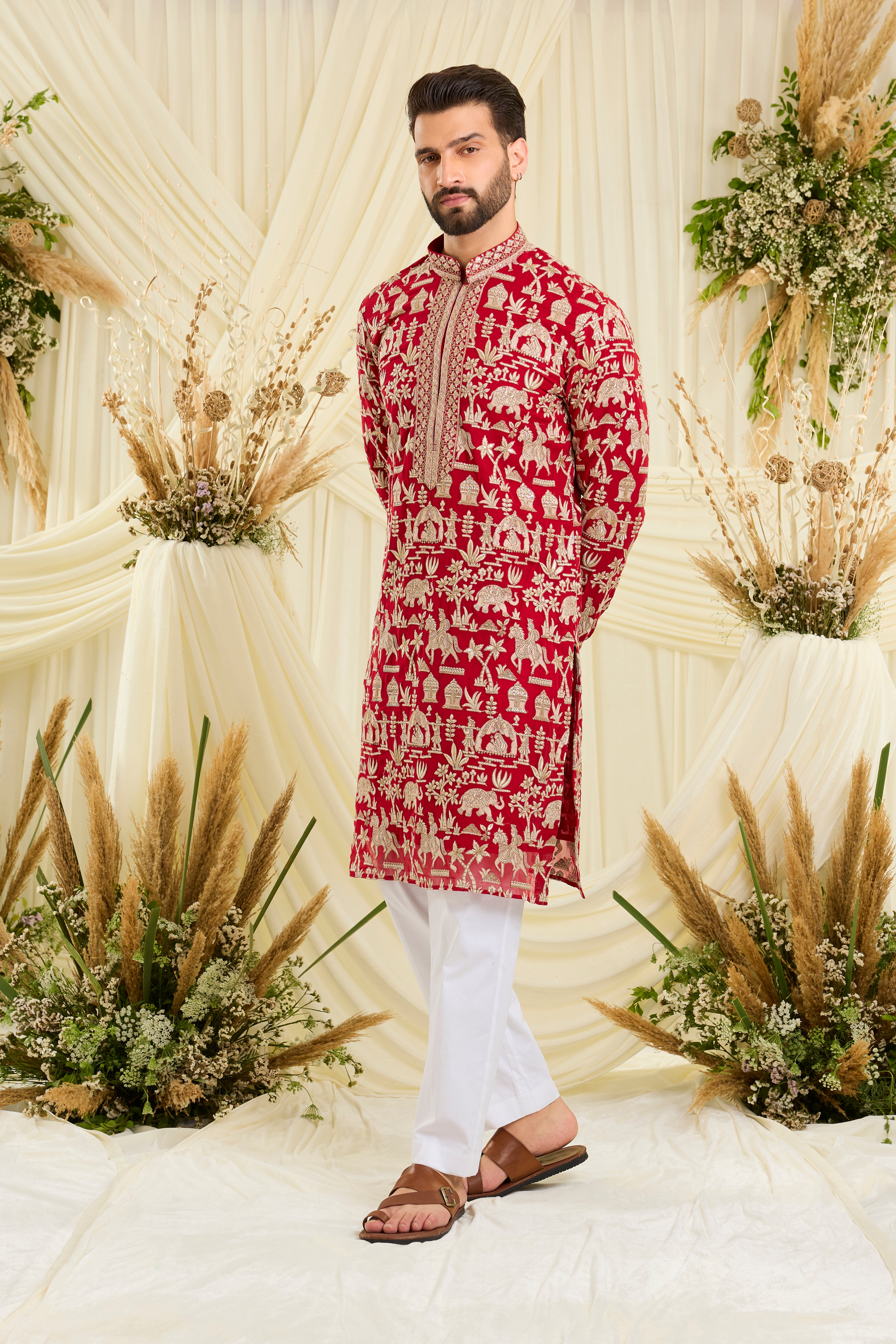 Red-pink Mughal era kurta with heavy zari work and a delicate neckline — regal, opulent, and timelessly refined