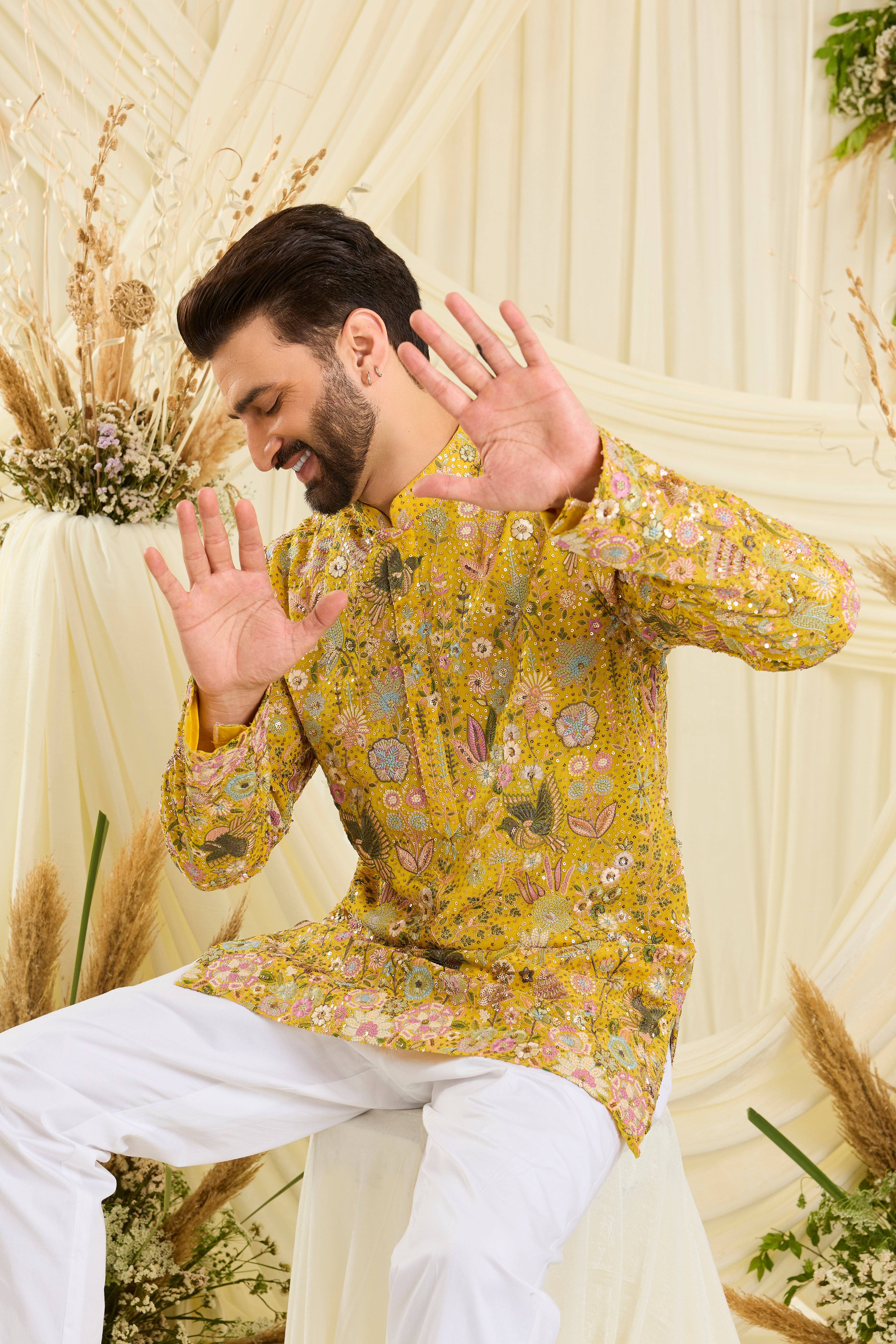 Yellow sequined  short kurta with intricate flora-fauna embroidery, multicolour threadwork, and detailed sequins for a fresh, elevated festive look.