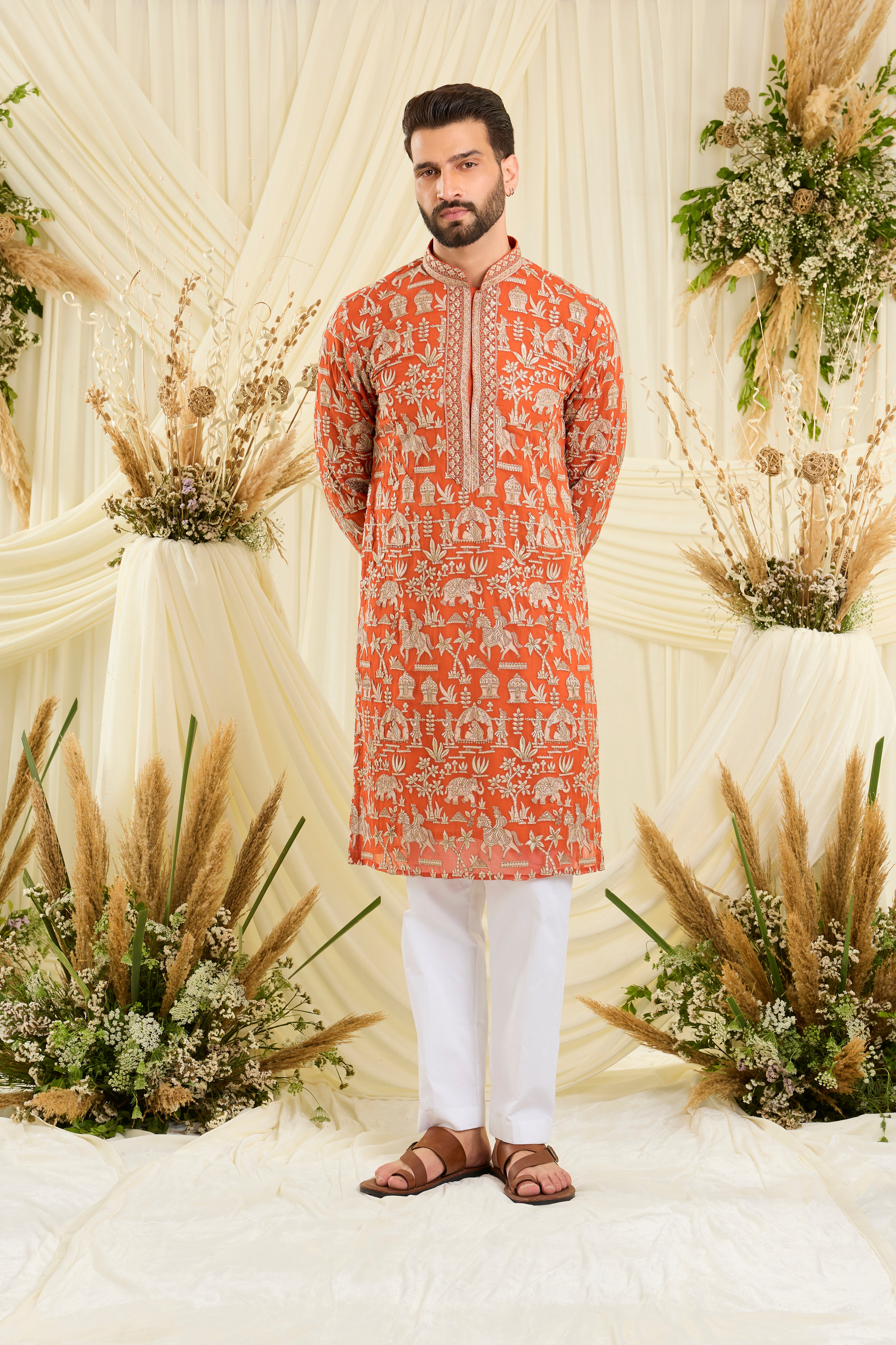 Orange Mughal era kurta with heavy zari work and a delicate neckline — regal, opulent, and timelessly refined
