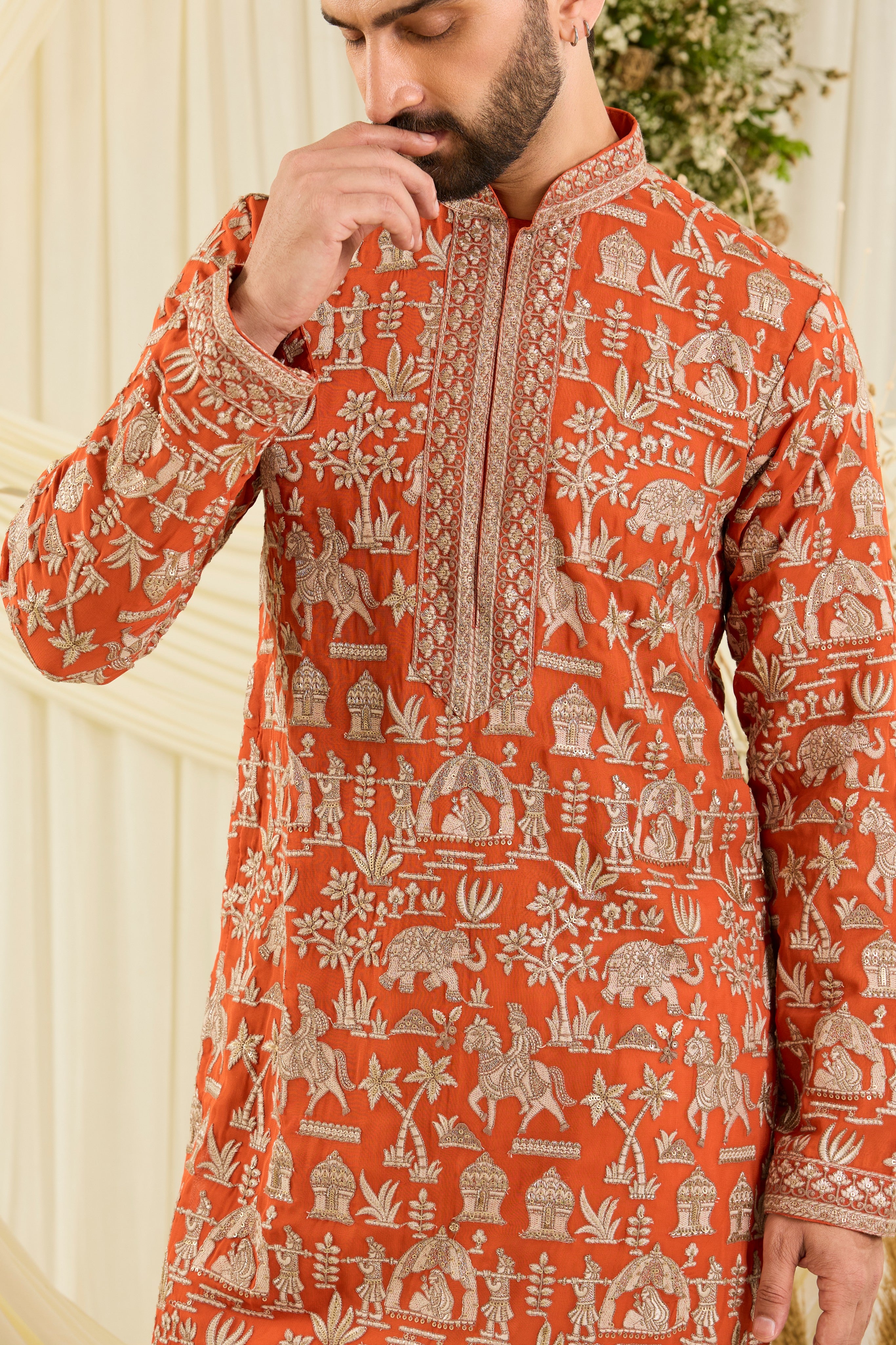 Orange Mughal era kurta with heavy zari work and a delicate neckline — regal, opulent, and timelessly refined