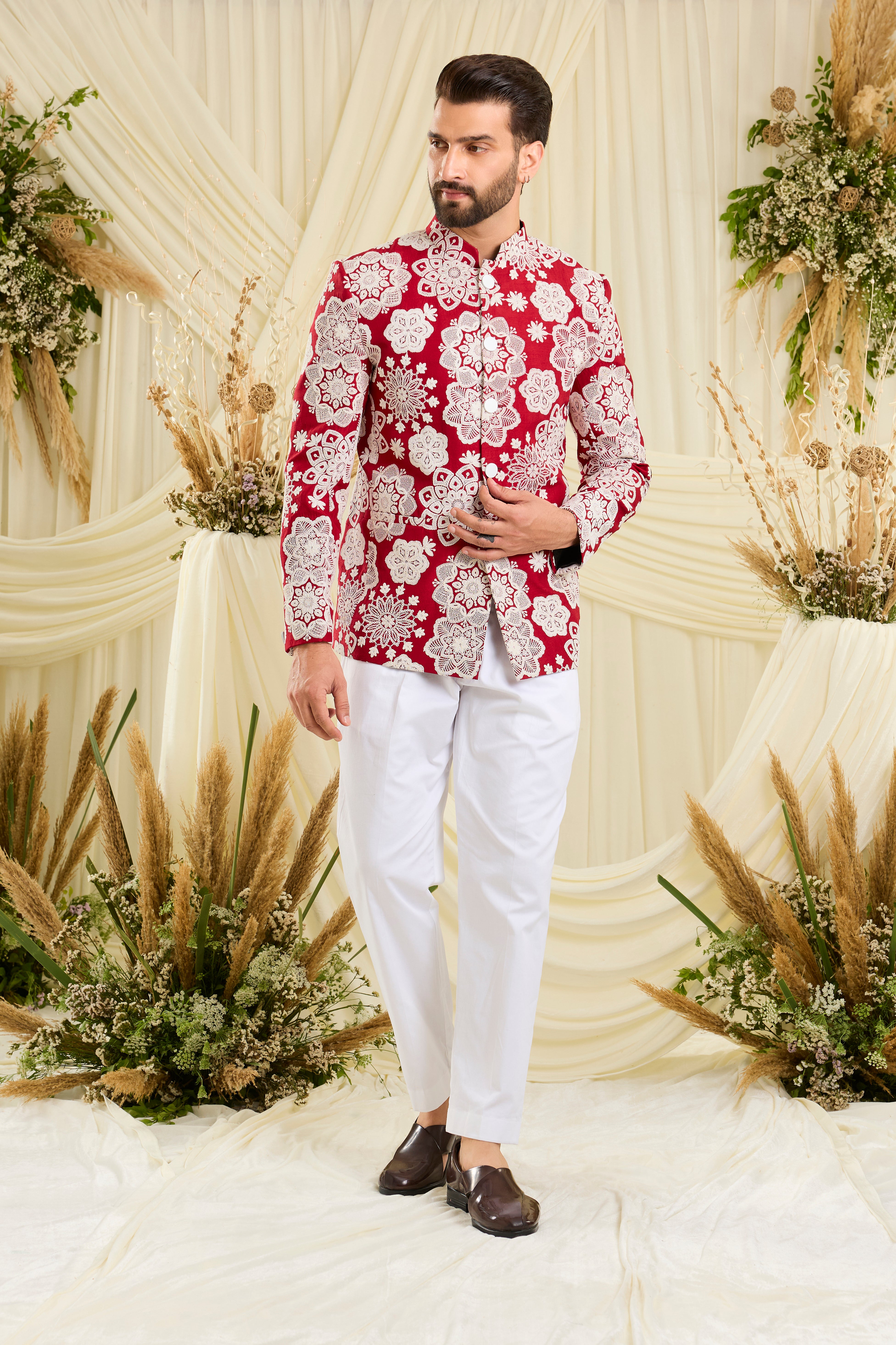 Red bandgala with intricate floral embroidery and heavy dori work, delivering a richly textured, bold festive statement.