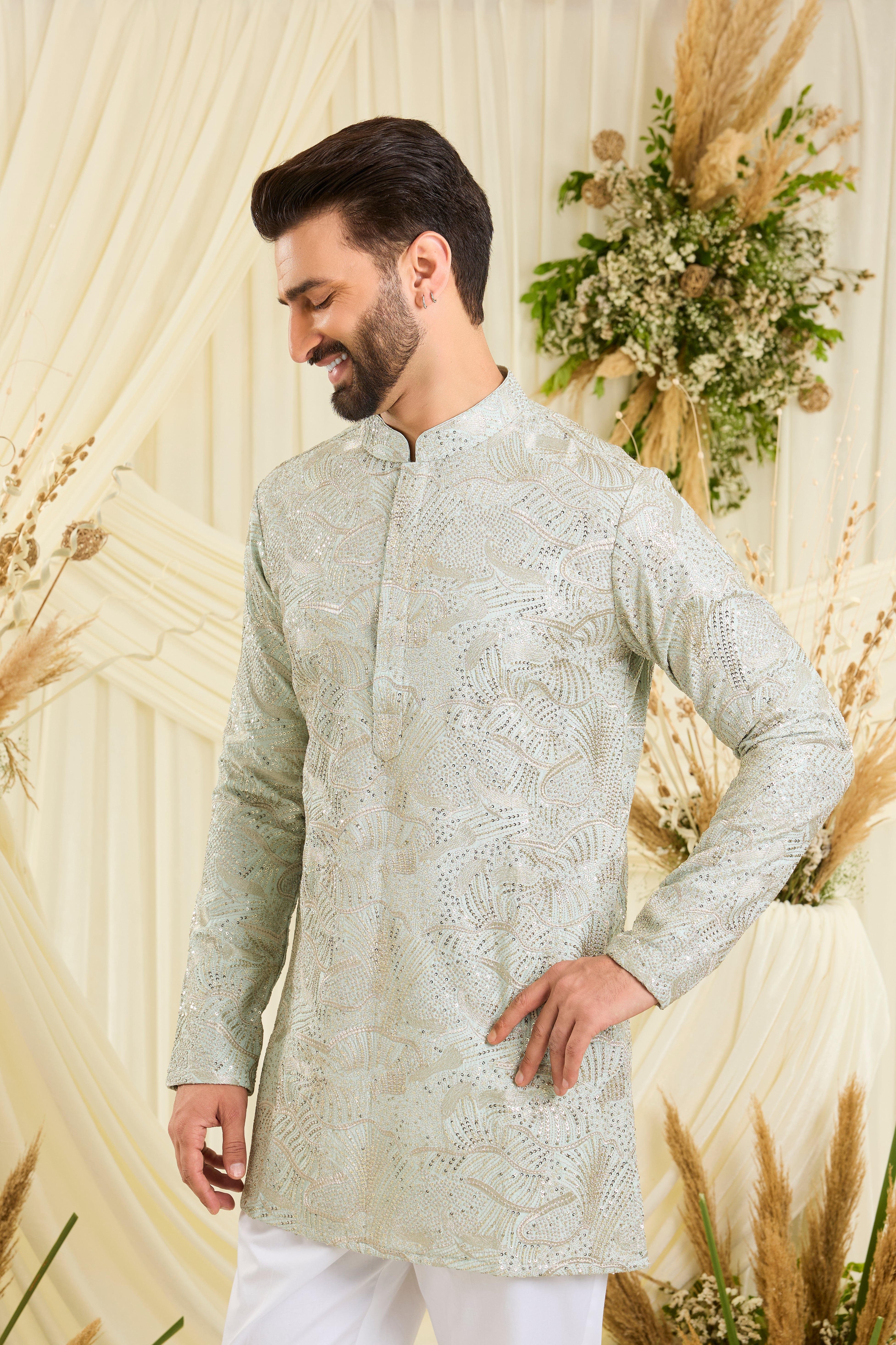 Pastel aqua blue sequined short kurta with an abstract design — fresh, luminous, and perfect for elevated day occasions.