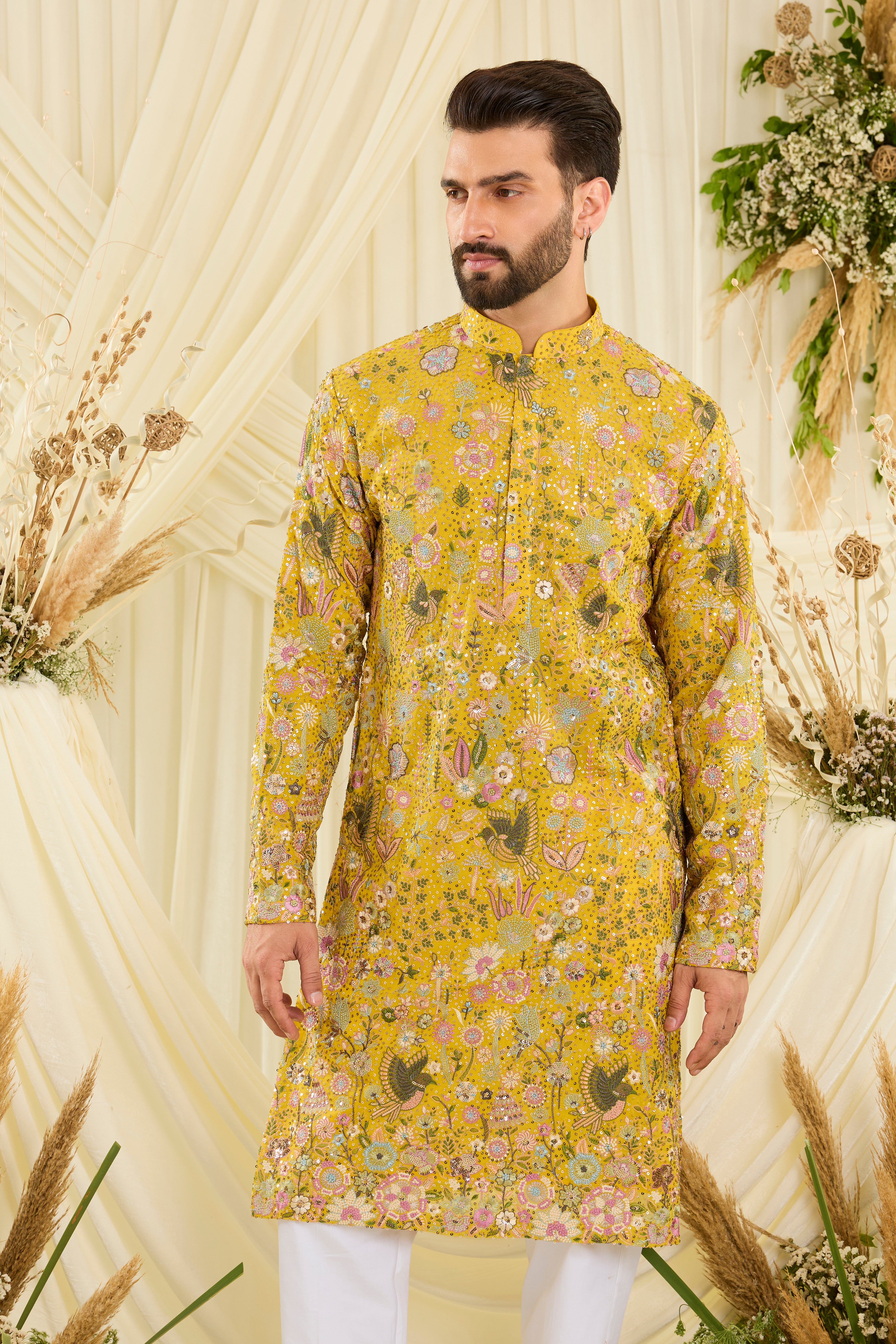 Yellow sequined   kurta with intricate flora-fauna embroidery, multicolour threadwork, and detailed sequins for a fresh, elevated festive look.