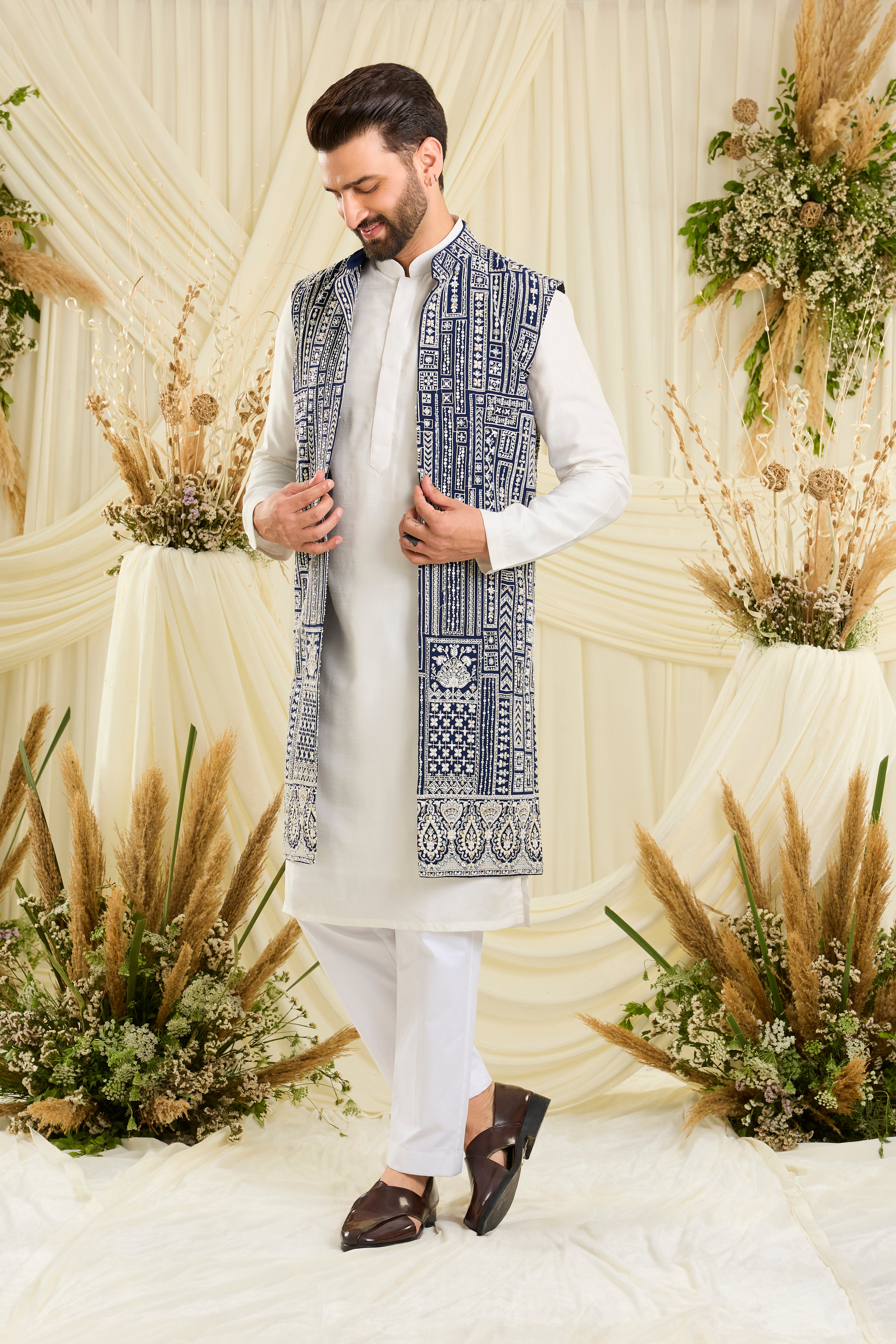 Royal blue long open jacket with intricate white cut dana work and delicate sequins, crafted for a bold, ultra-luxurious statement.