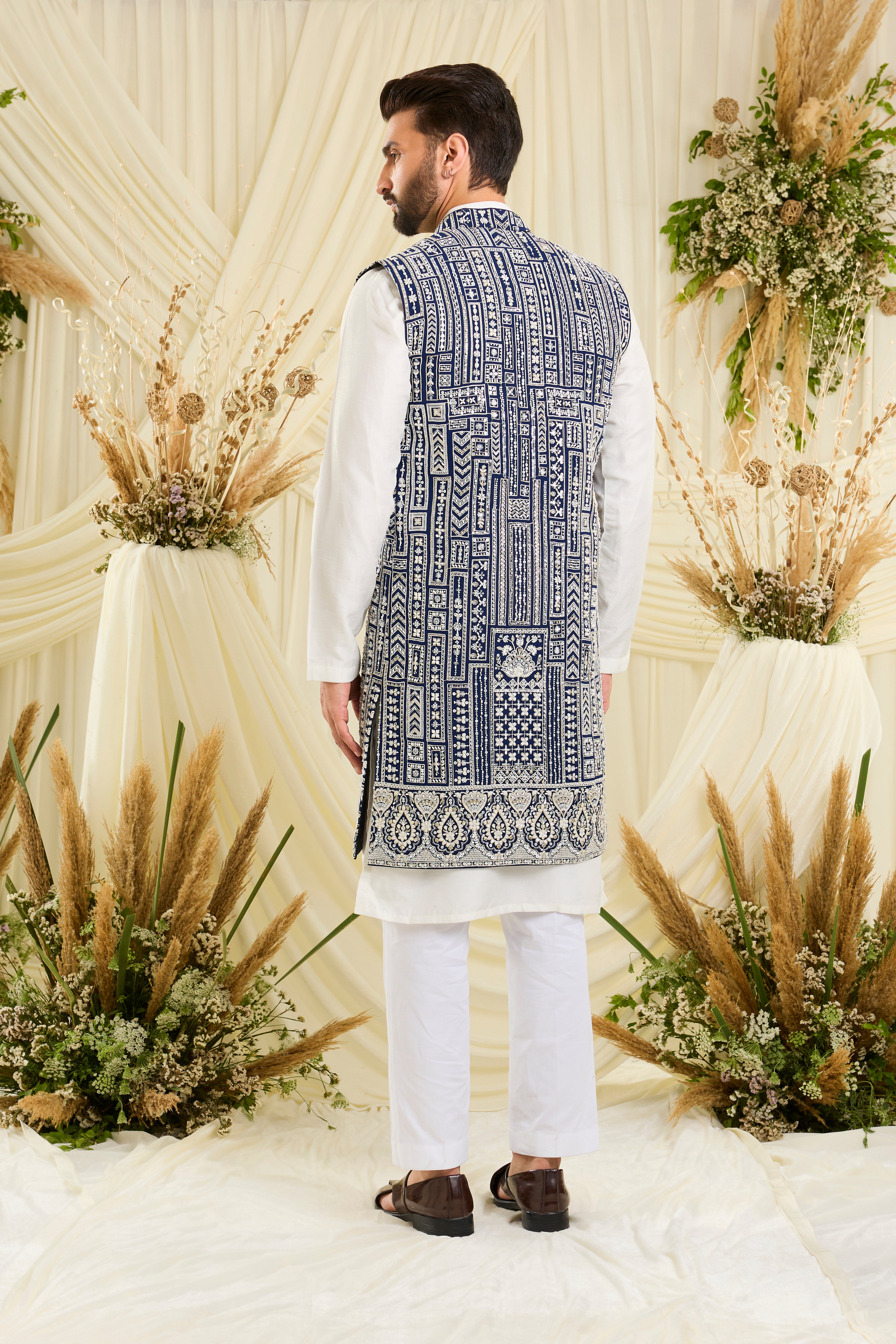 Royal blue long open jacket with intricate white cut dana work and delicate sequins, crafted for a bold, ultra-luxurious statement.