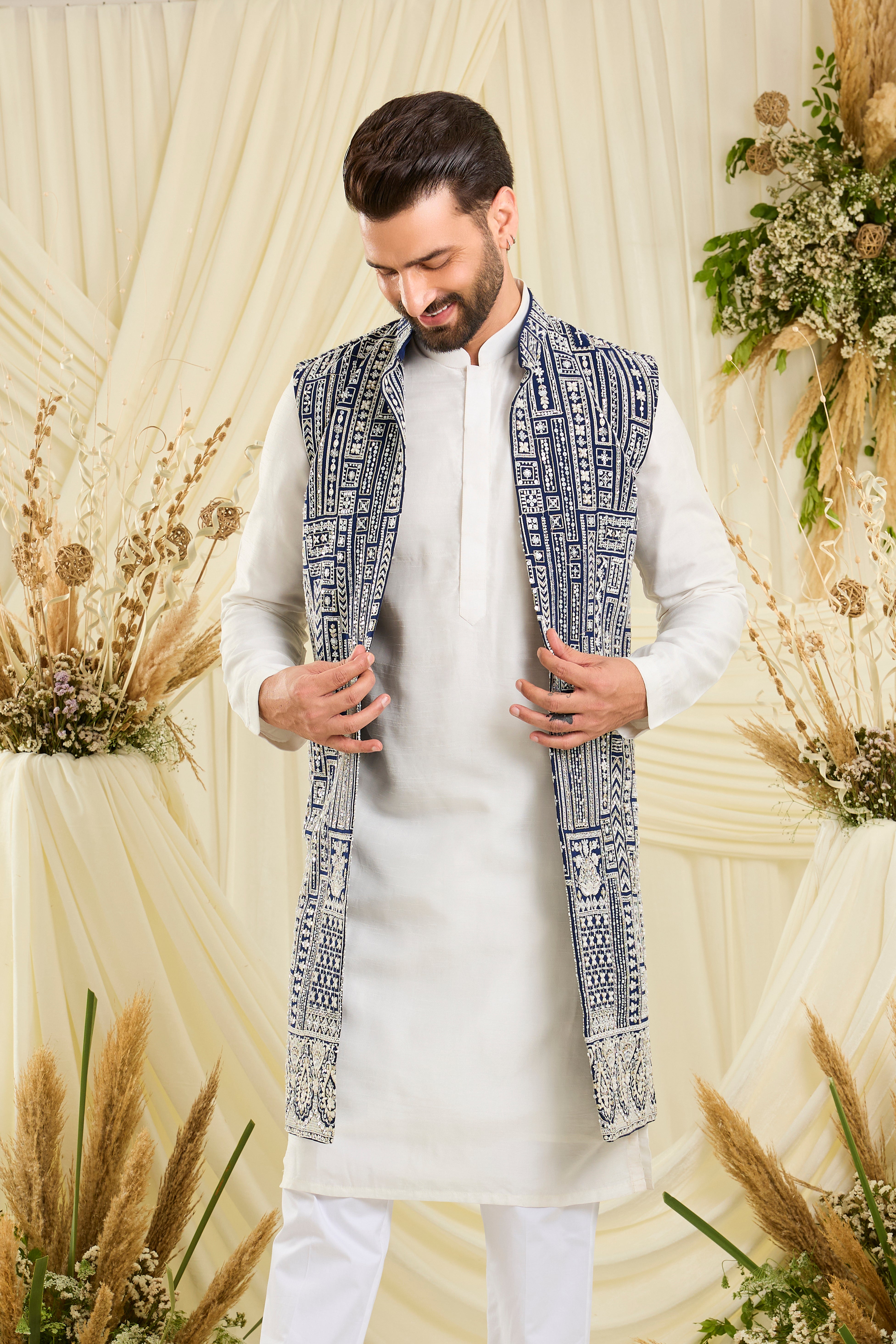 Royal blue long open jacket with intricate white cut dana work and delicate sequins, crafted for a bold, ultra-luxurious statement.
