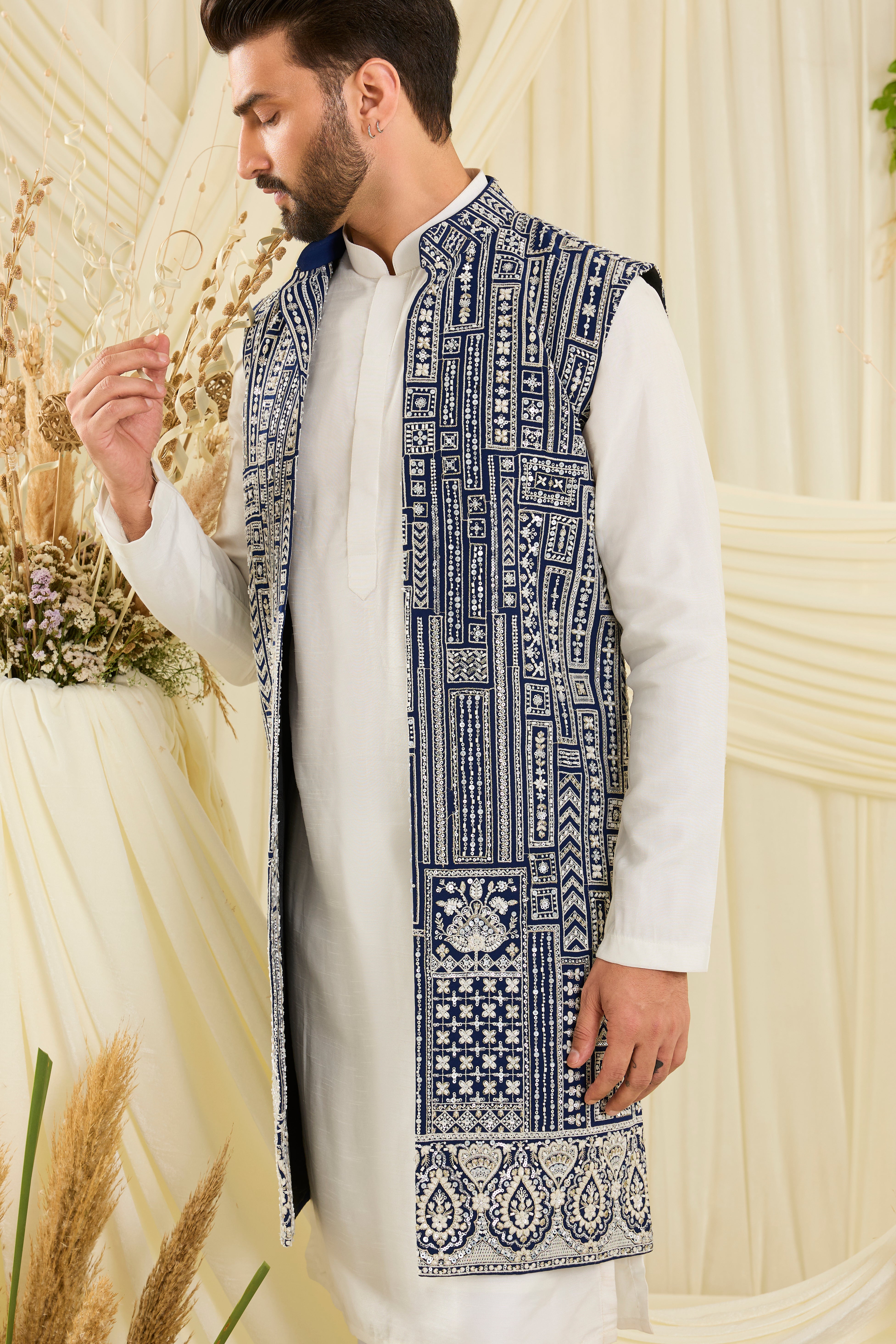 Royal blue long open jacket with intricate white cut dana work and delicate sequins, crafted for a bold, ultra-luxurious statement.