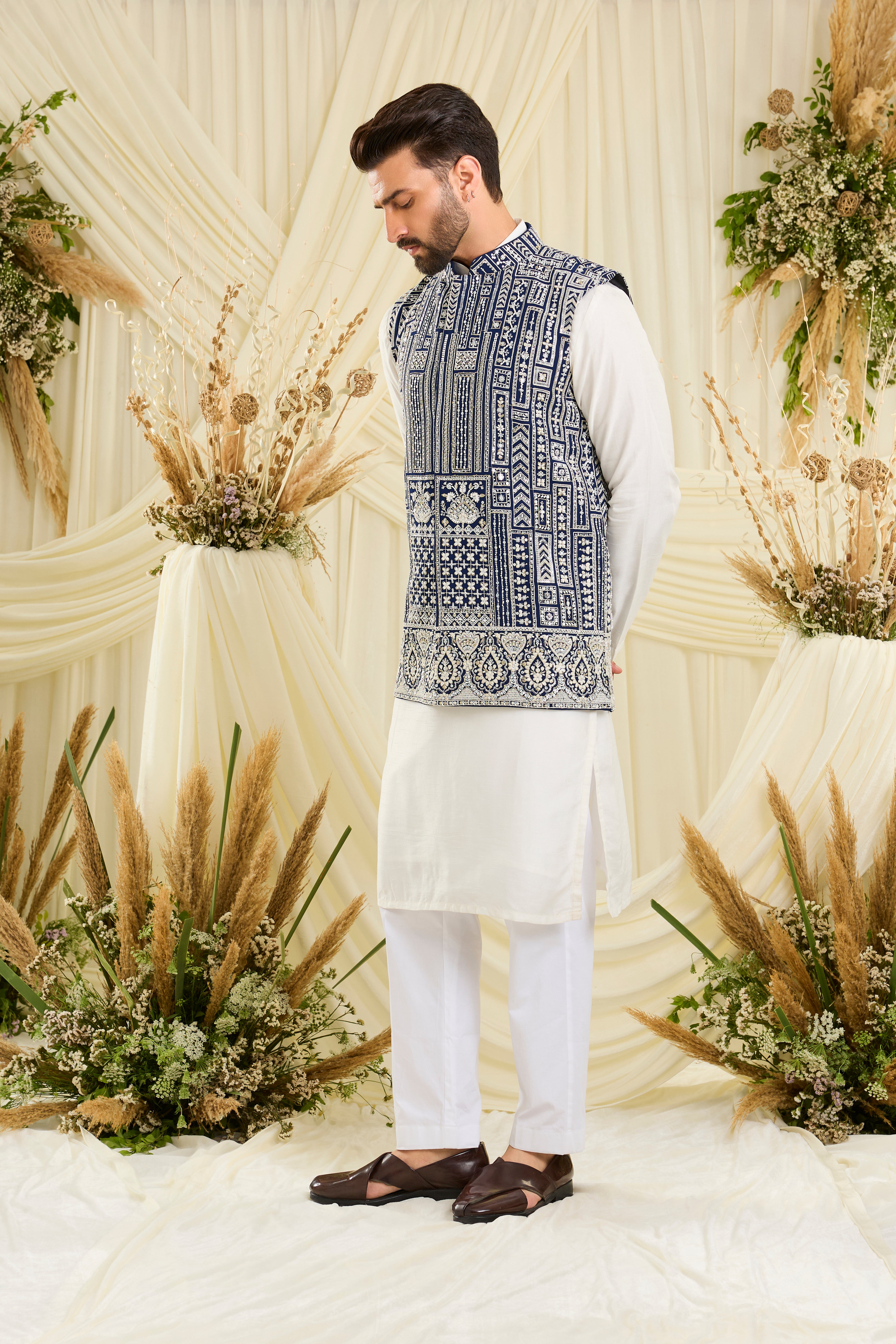 Royal blue nehru jacket with intricate white cut dana work and delicate sequins, crafted for a bold, ultra-luxurious statement.