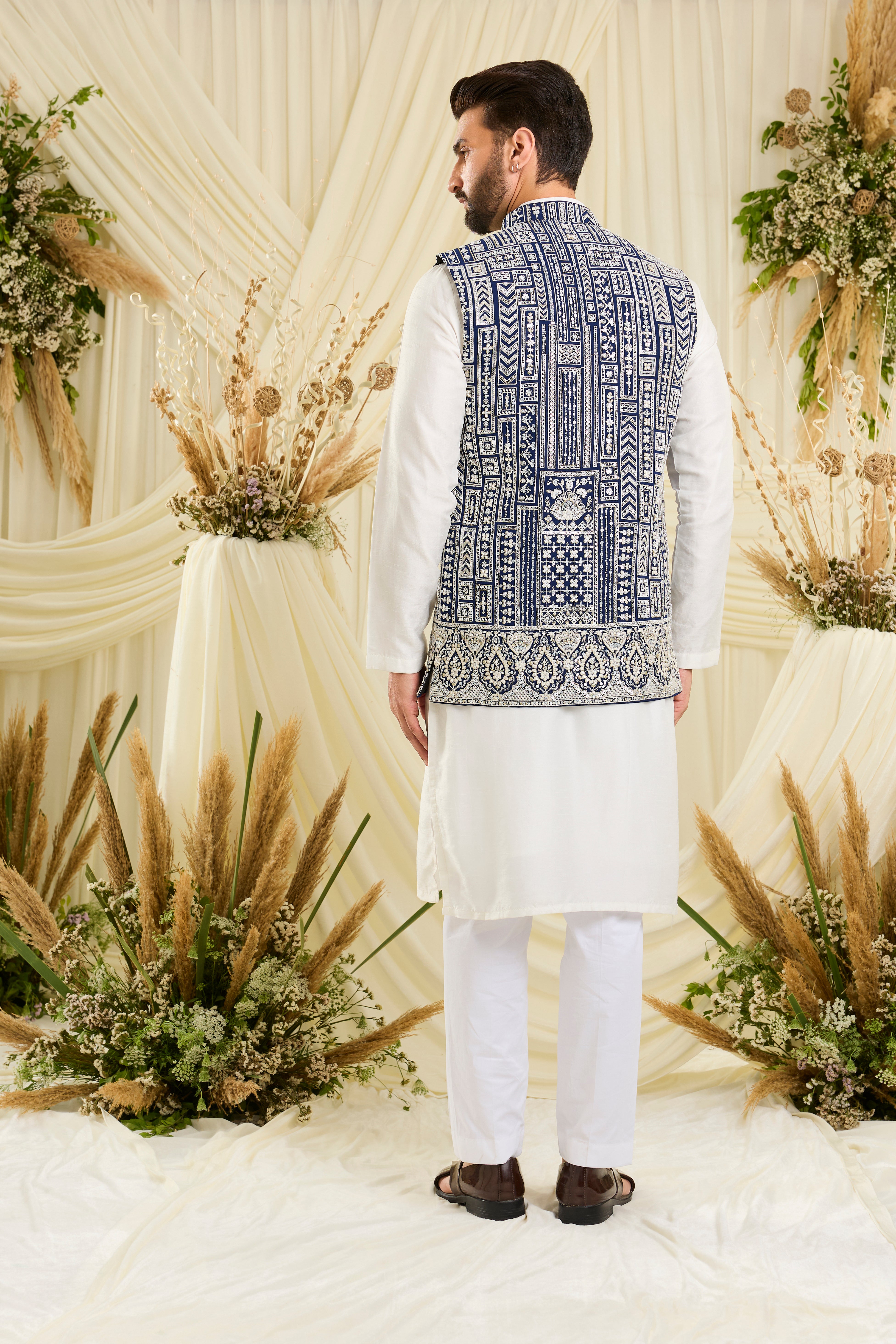 Royal blue nehru jacket with intricate white cut dana work and delicate sequins, crafted for a bold, ultra-luxurious statement.